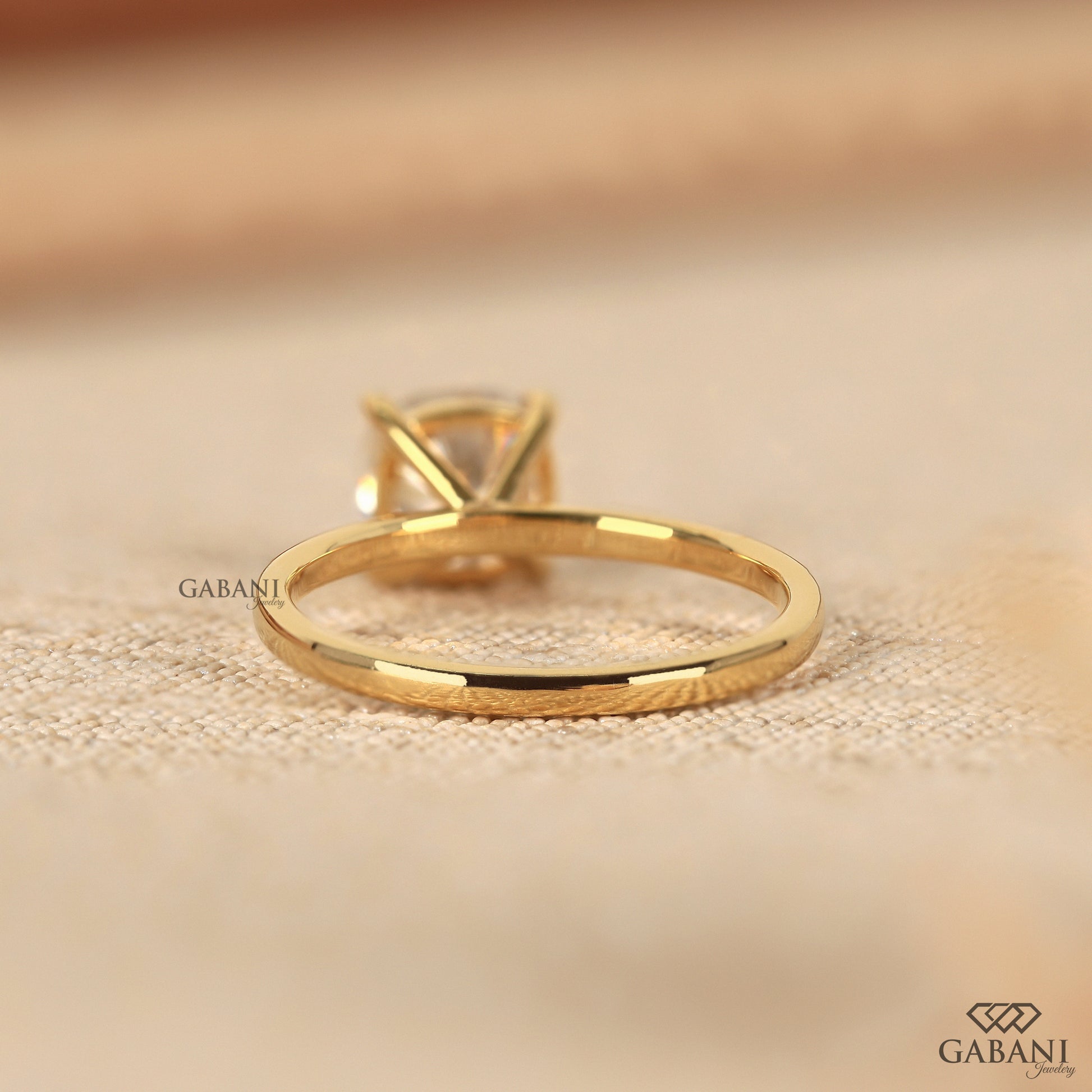 cushion cut diamond solitaire ring with smooth pipe shank band