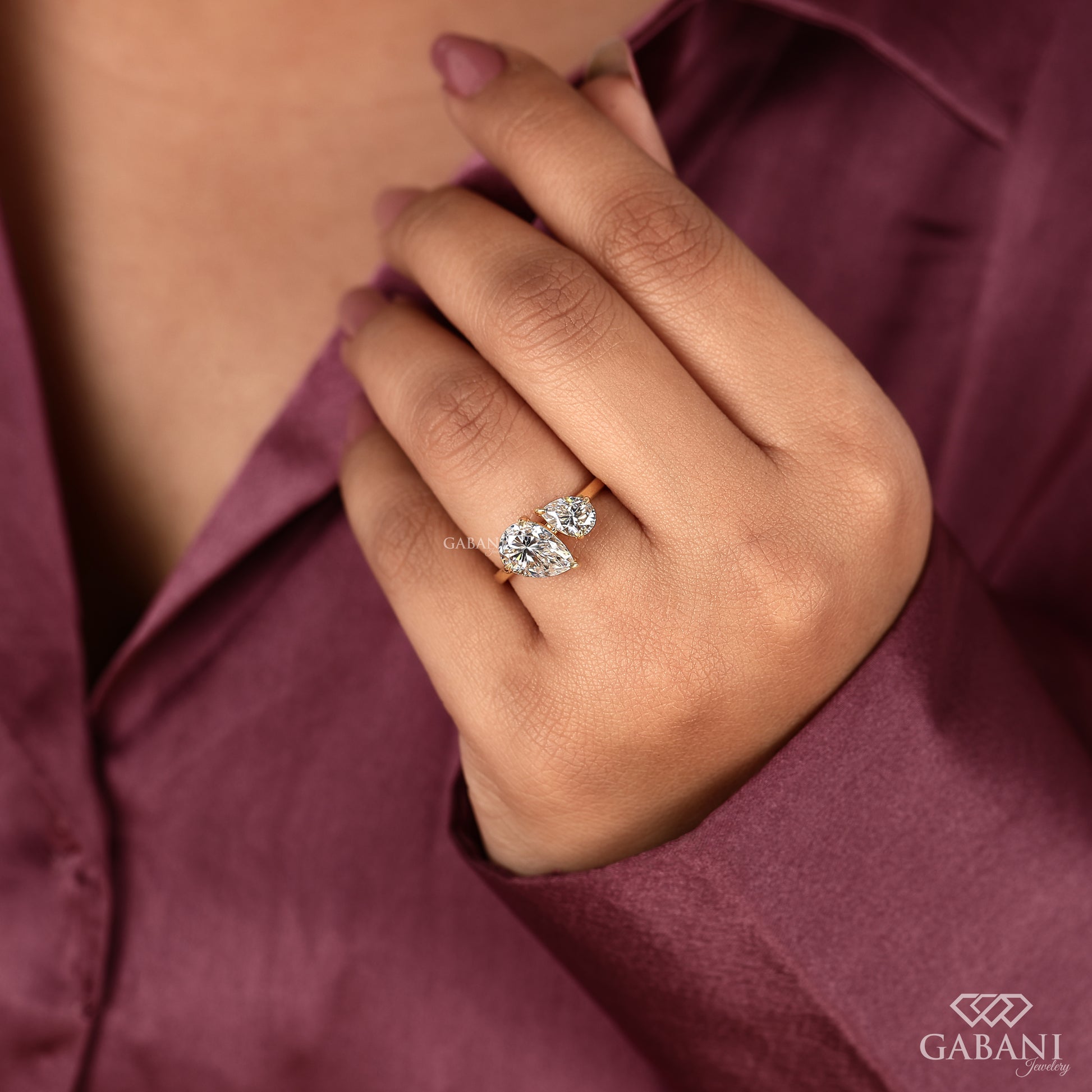 two pear shaped lab grown diamond ring in yellow gold with a symbolic toi et moi setting