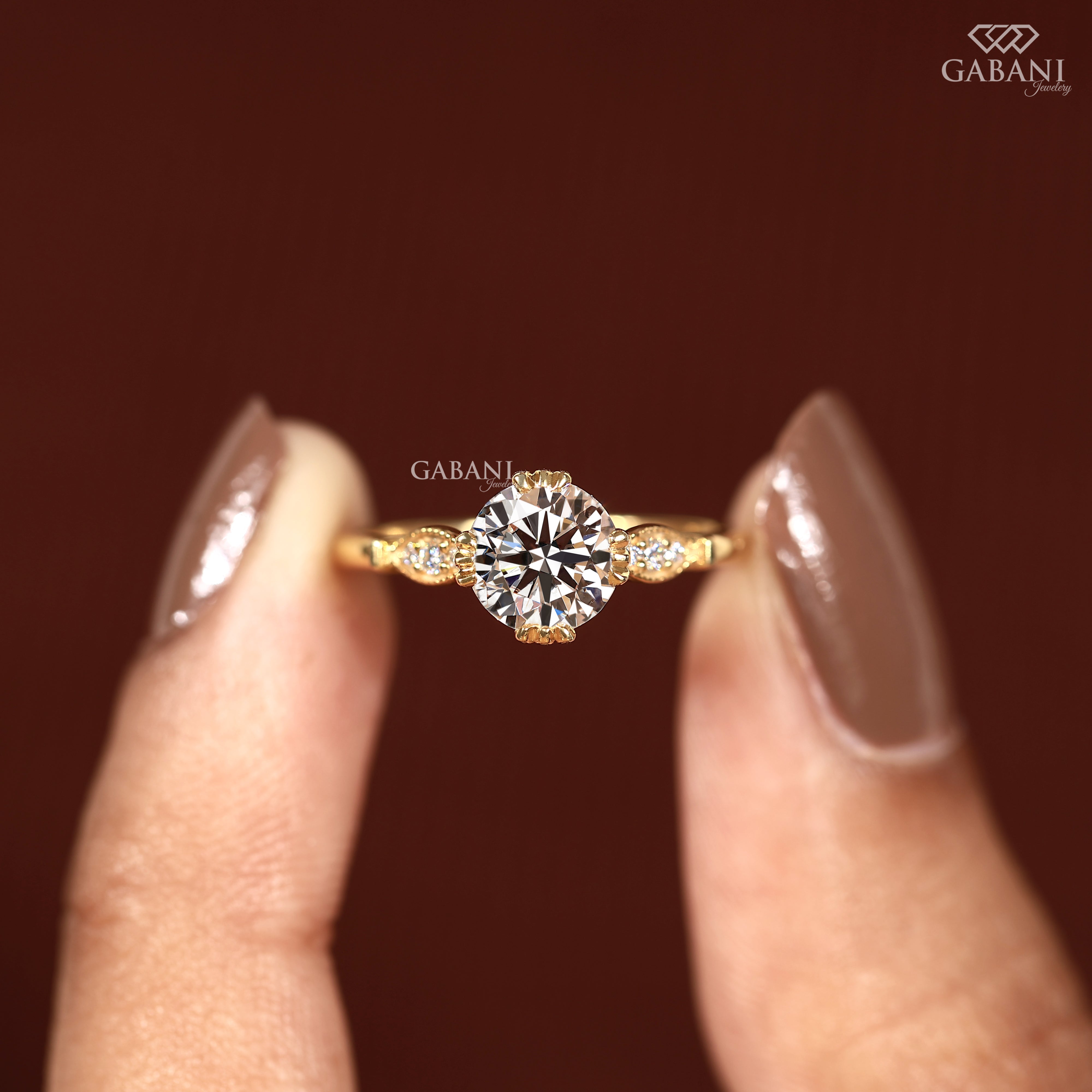 Hand holding IGI certified round lab grown diamond engagement ring by Gabani Jewelry