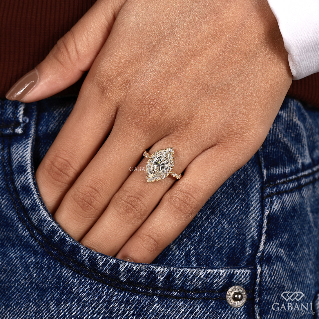 Lab grown marquise diamond engagement ring with sparkling halo setting