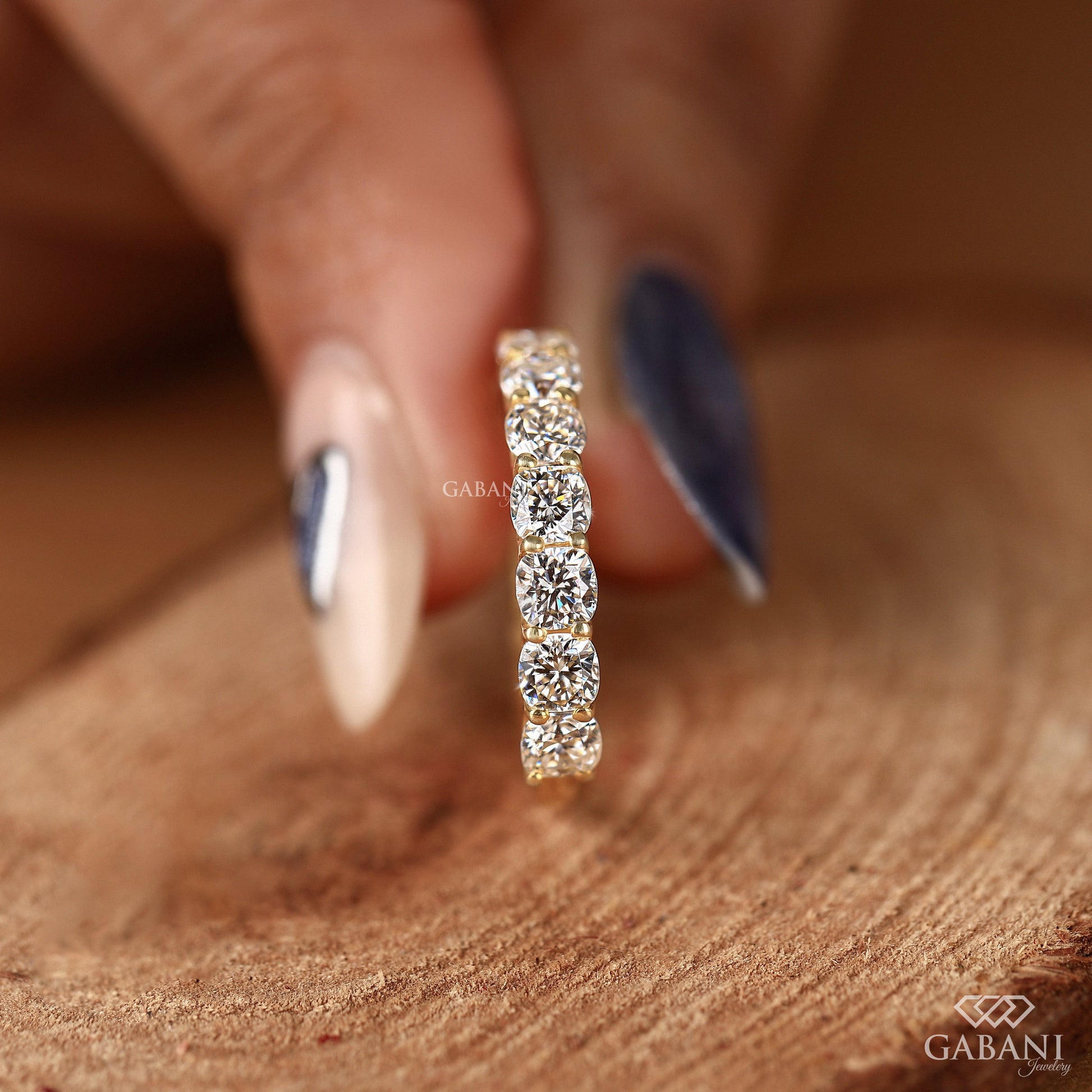 cushion cut lab created diamond ring set in yellow gold with a secure u prong setting