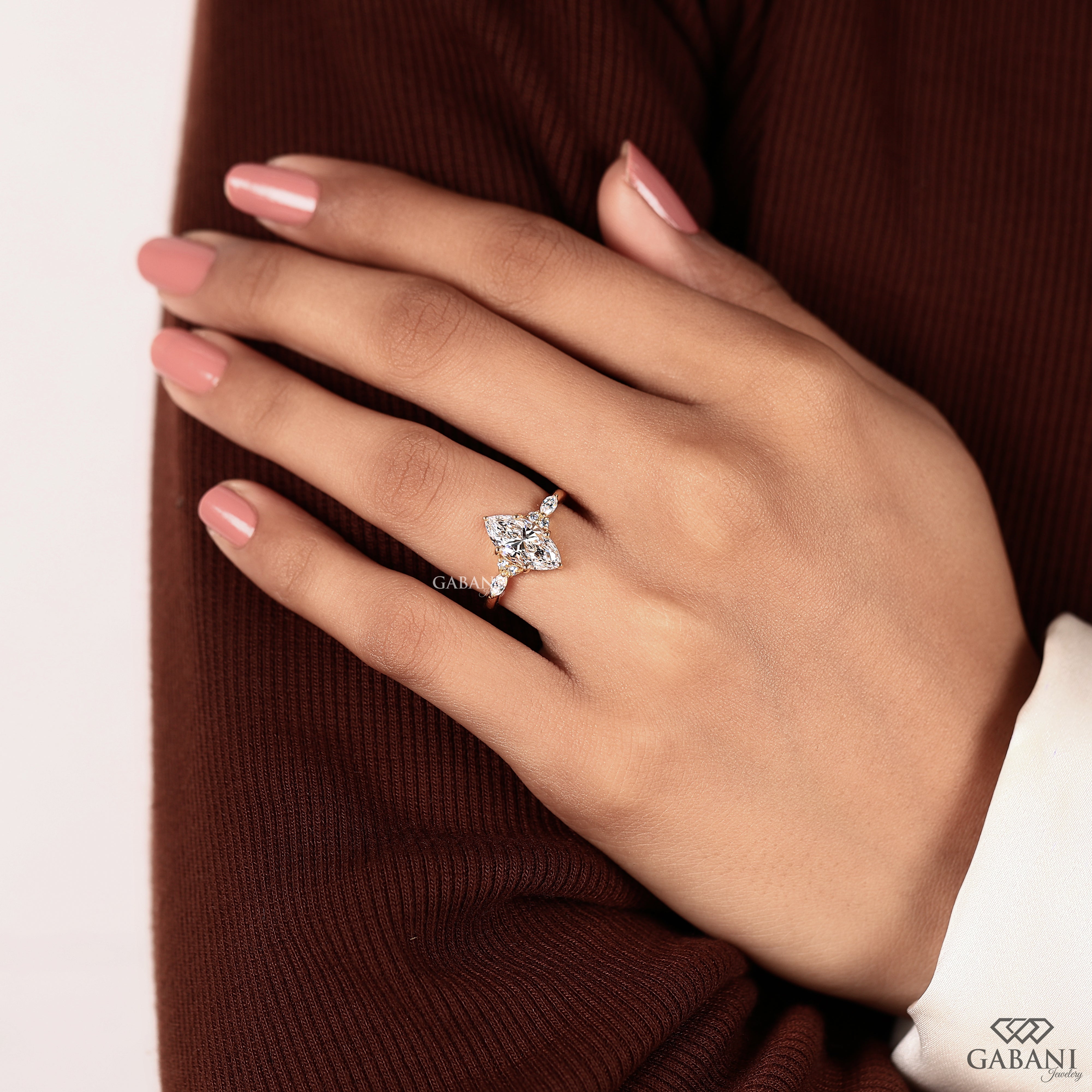 Lab grown marquise diamond ring with pear and round side stones