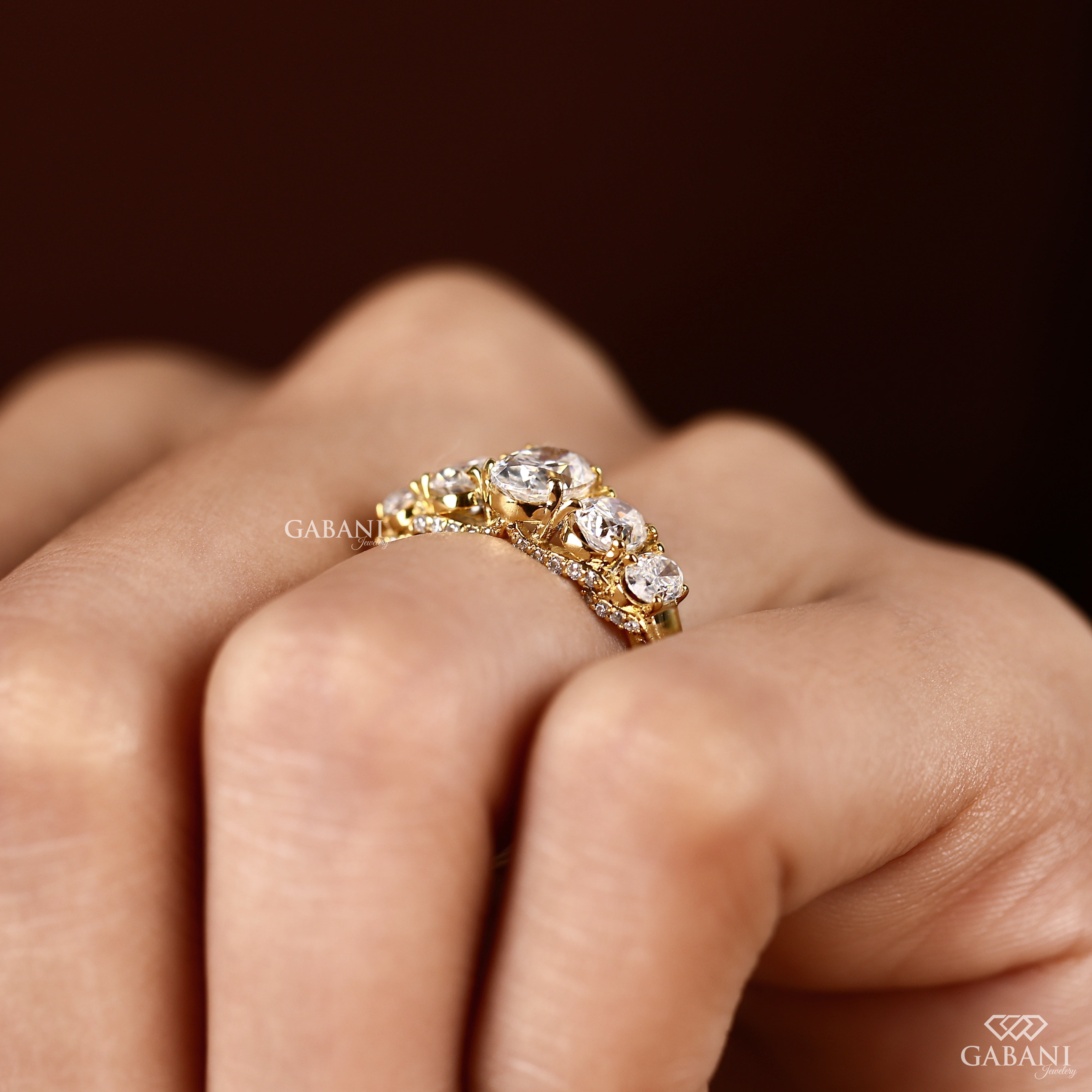 Lab grown oval diamond ring with graduated center and side stones