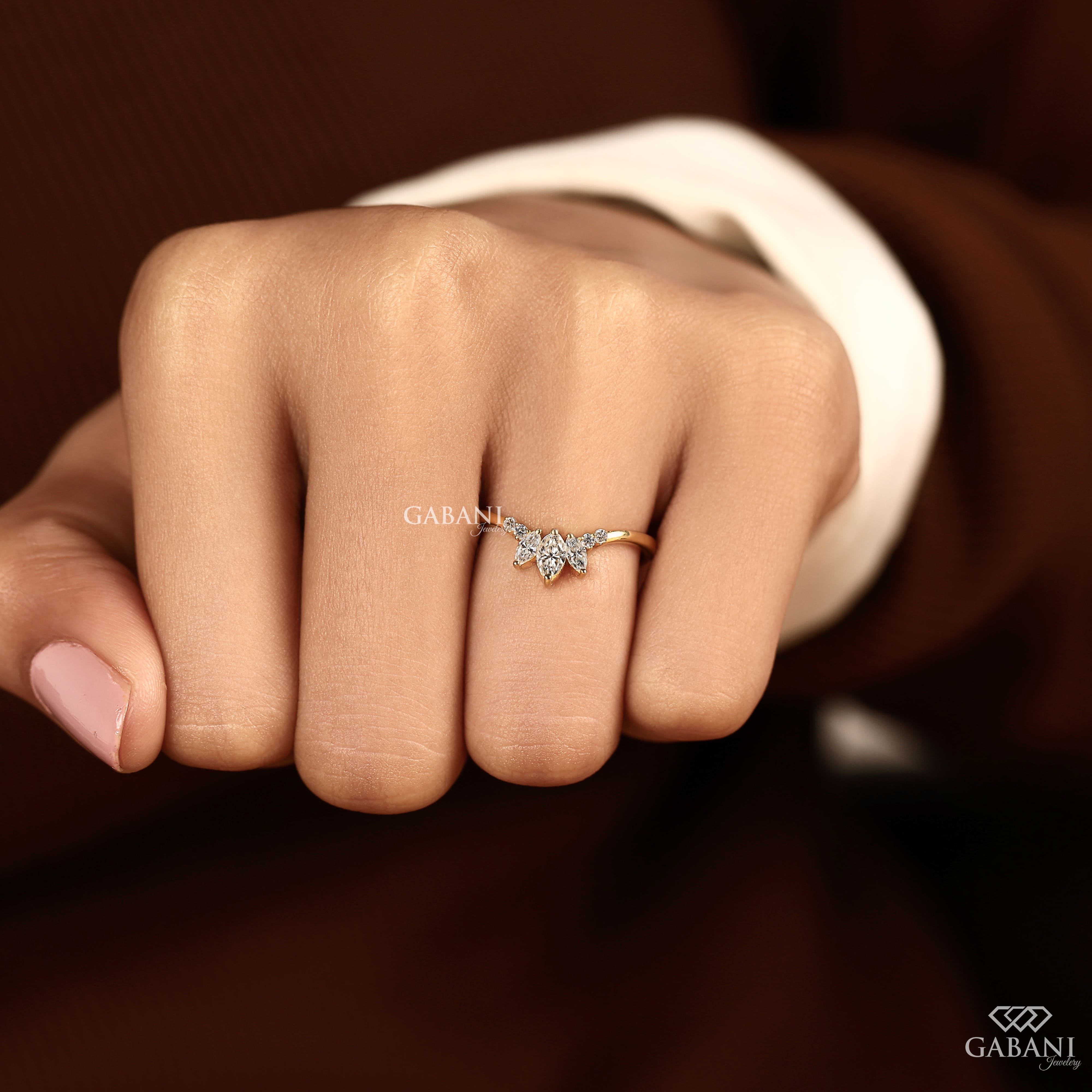Marquise and round cut lab grown diamond curved wedding band in 14K yellow gold with a contour design, ideal for stacking with an engagement ring.