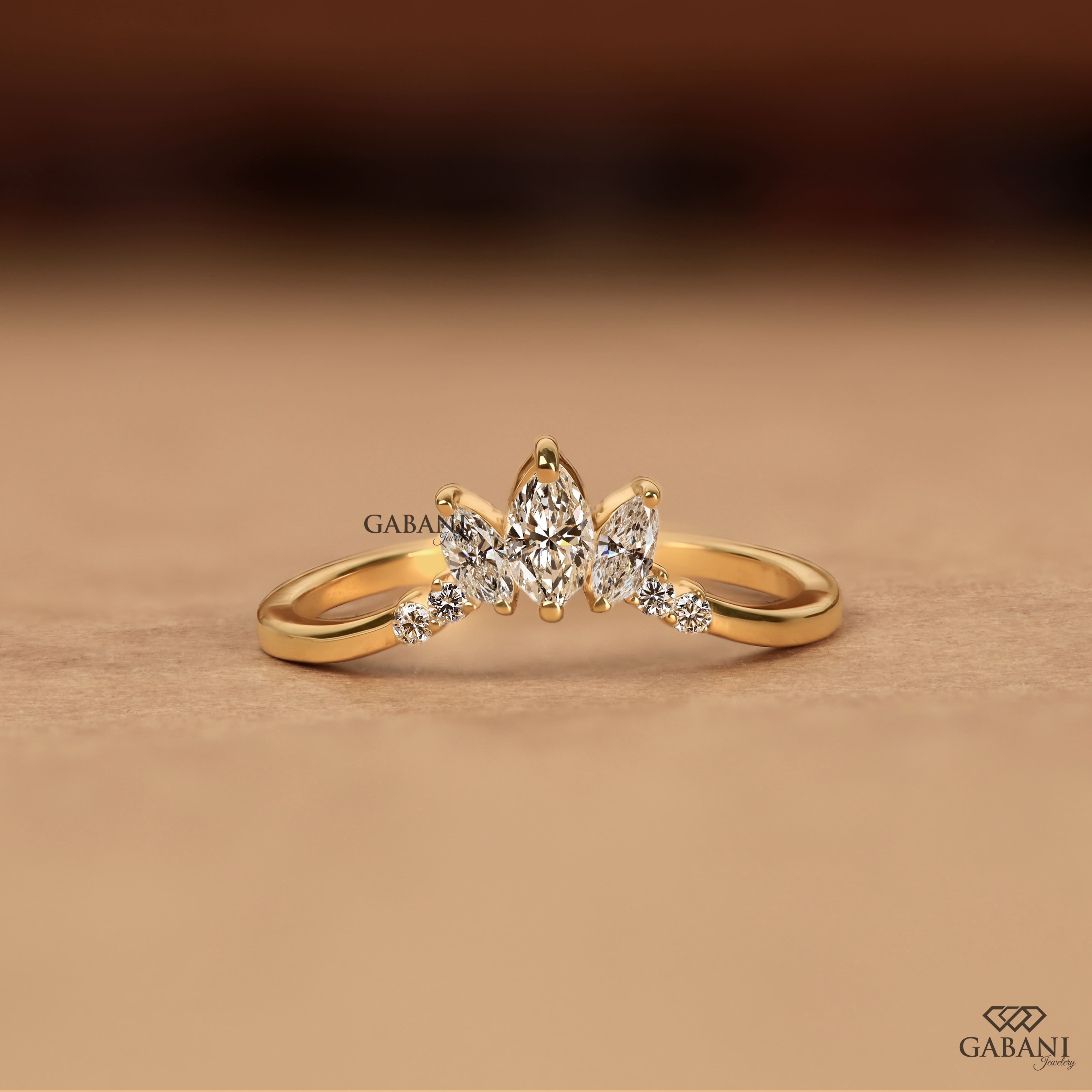 Marquise and round cut lab grown diamond curved wedding band in 14K yellow gold with a contour design, ideal for stacking with an engagement ring.