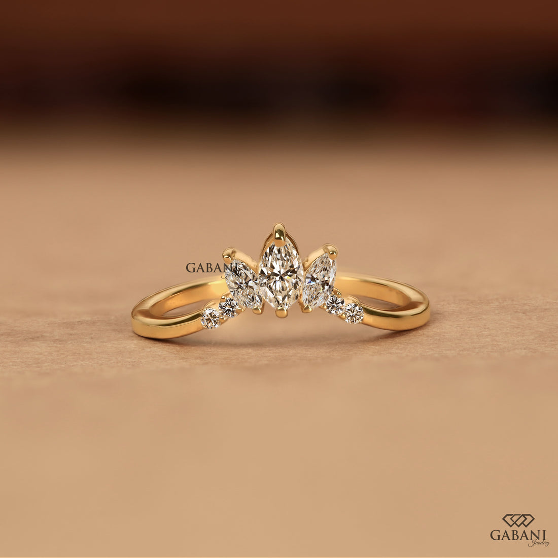 Marquise and round cut lab grown diamond curved wedding band in 14K yellow gold with a contour design, ideal for stacking with an engagement ring.