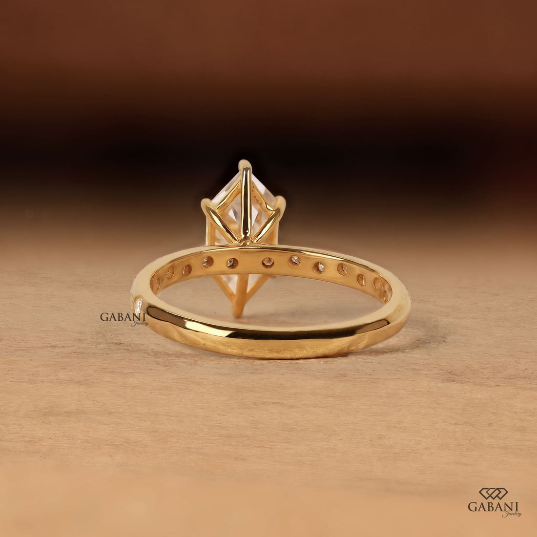 Marquise cut lab grown diamond engagement ring with sparkling round diamond accent band and elegant prong setting