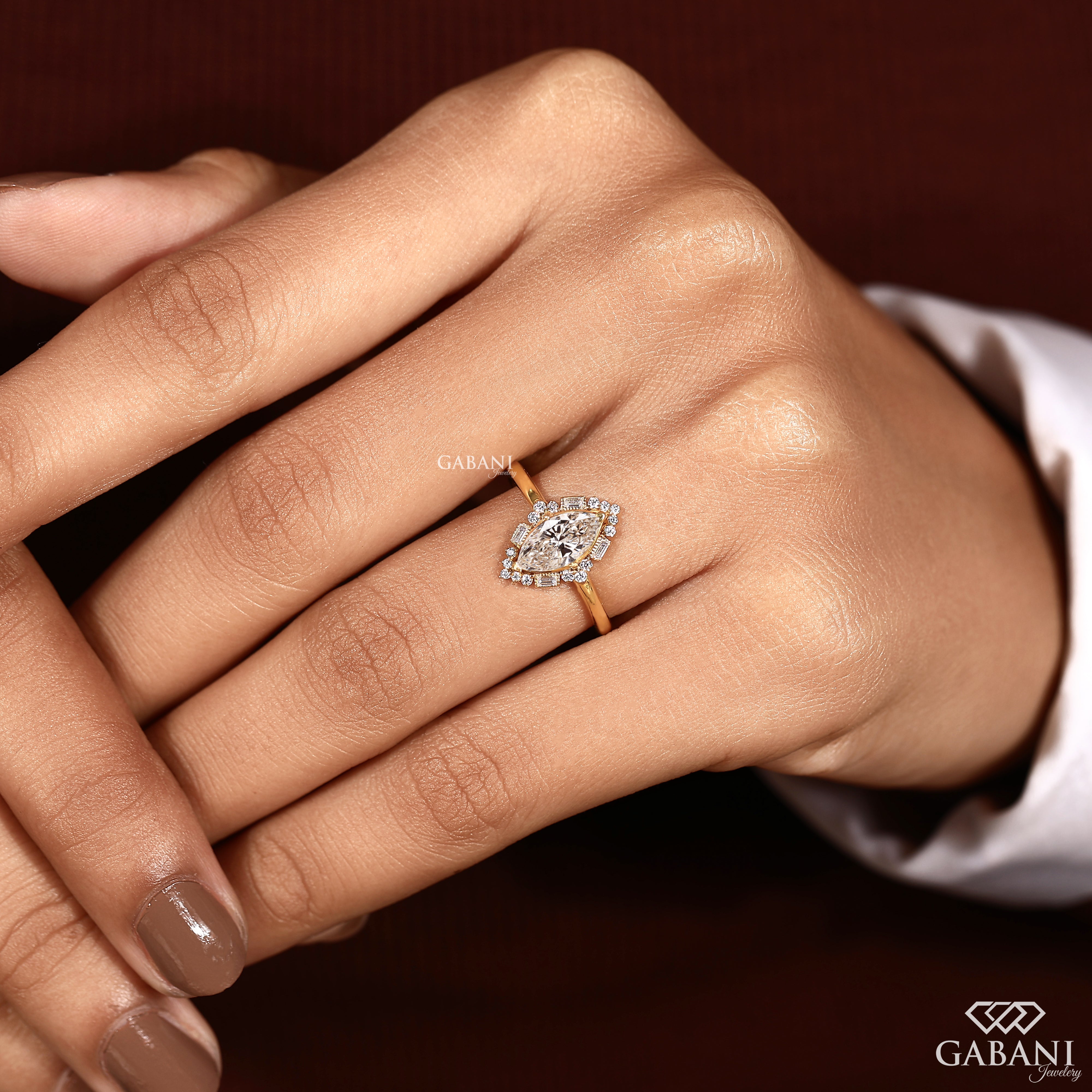 Marquise cut diamond ring with lab grown center and baguette accents