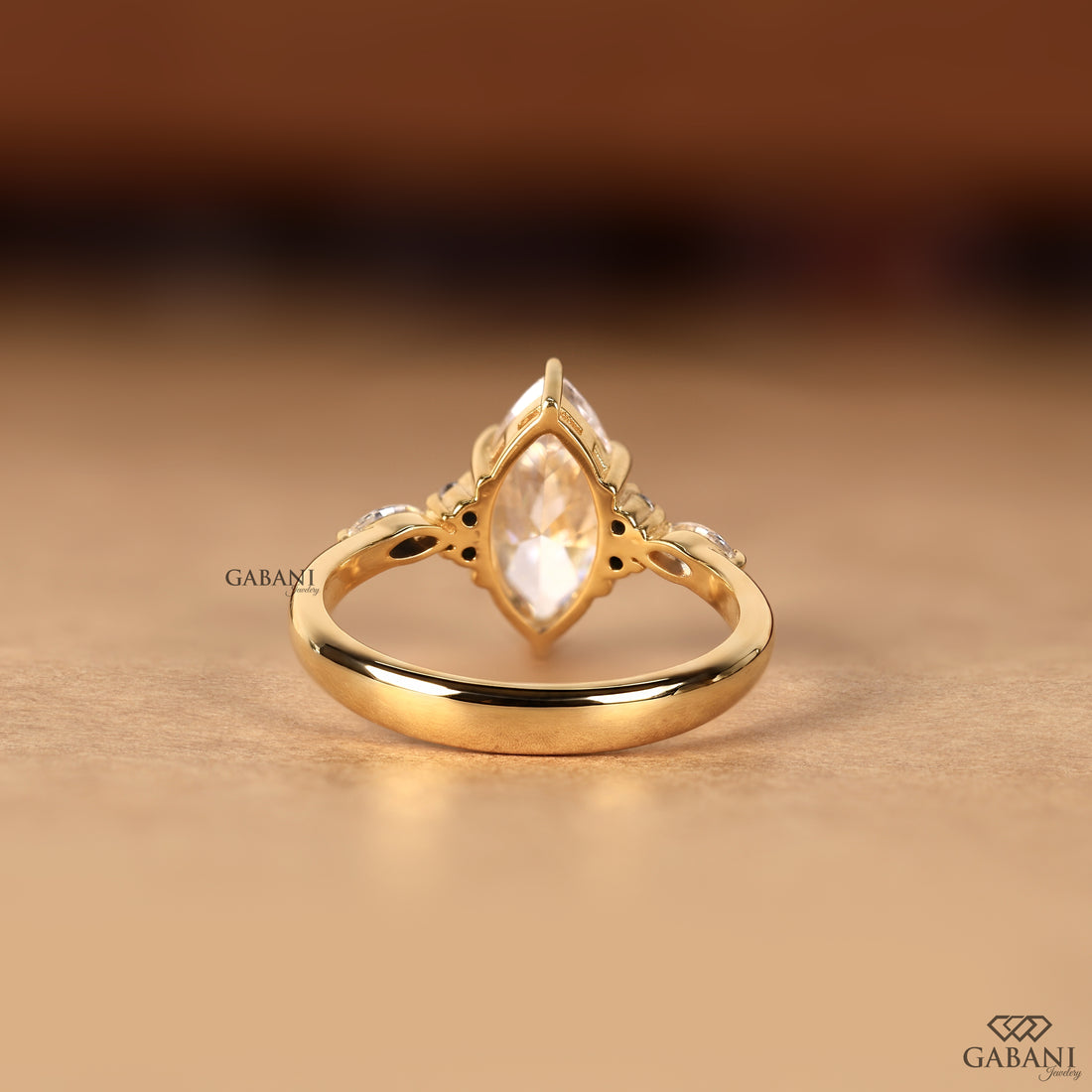 Marquise cut lab grown diamond proposal ring with pear side stones