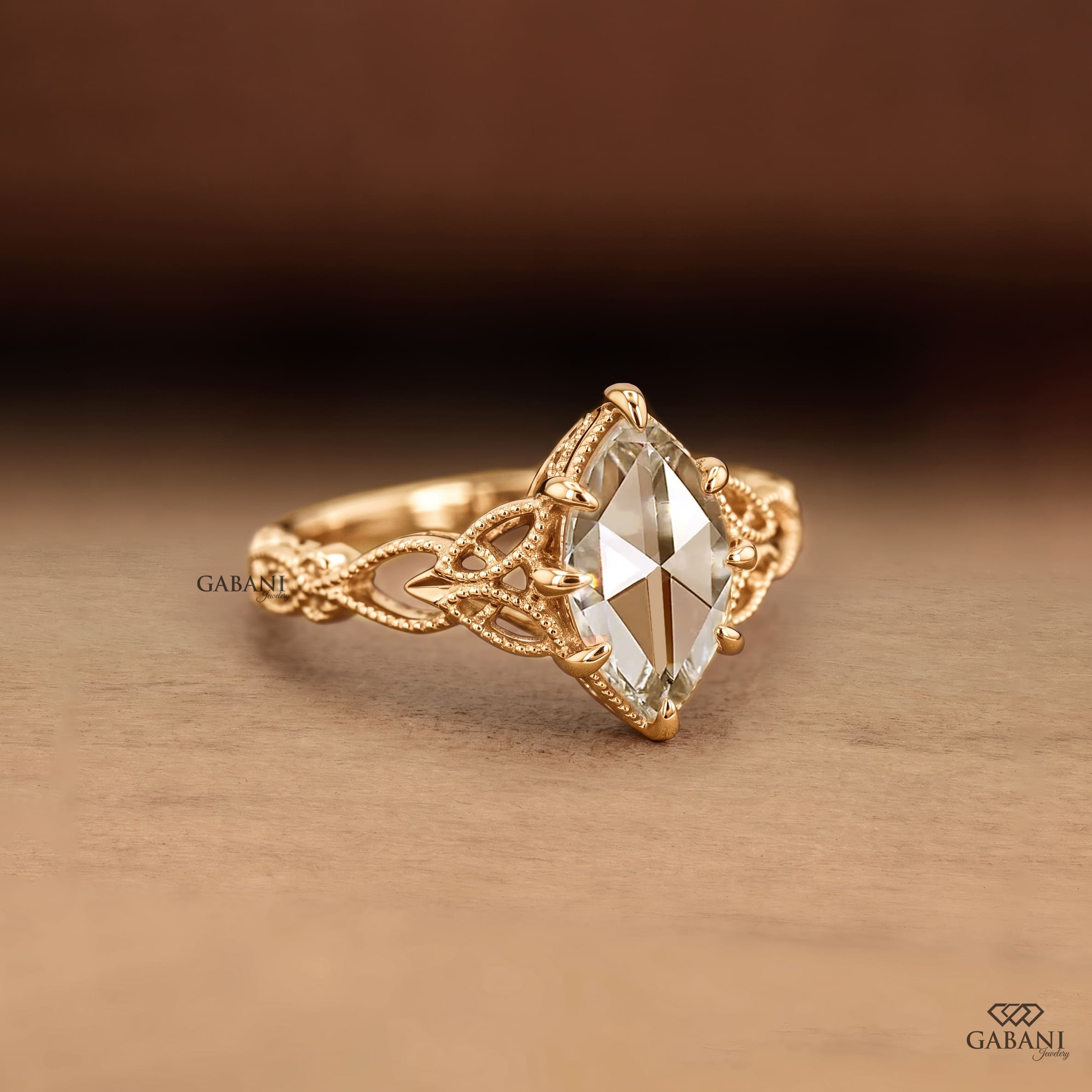Marquise rose cut lab grown diamond engagement ring with round diamond accents, nature inspired leaf details and yellow gold setting.