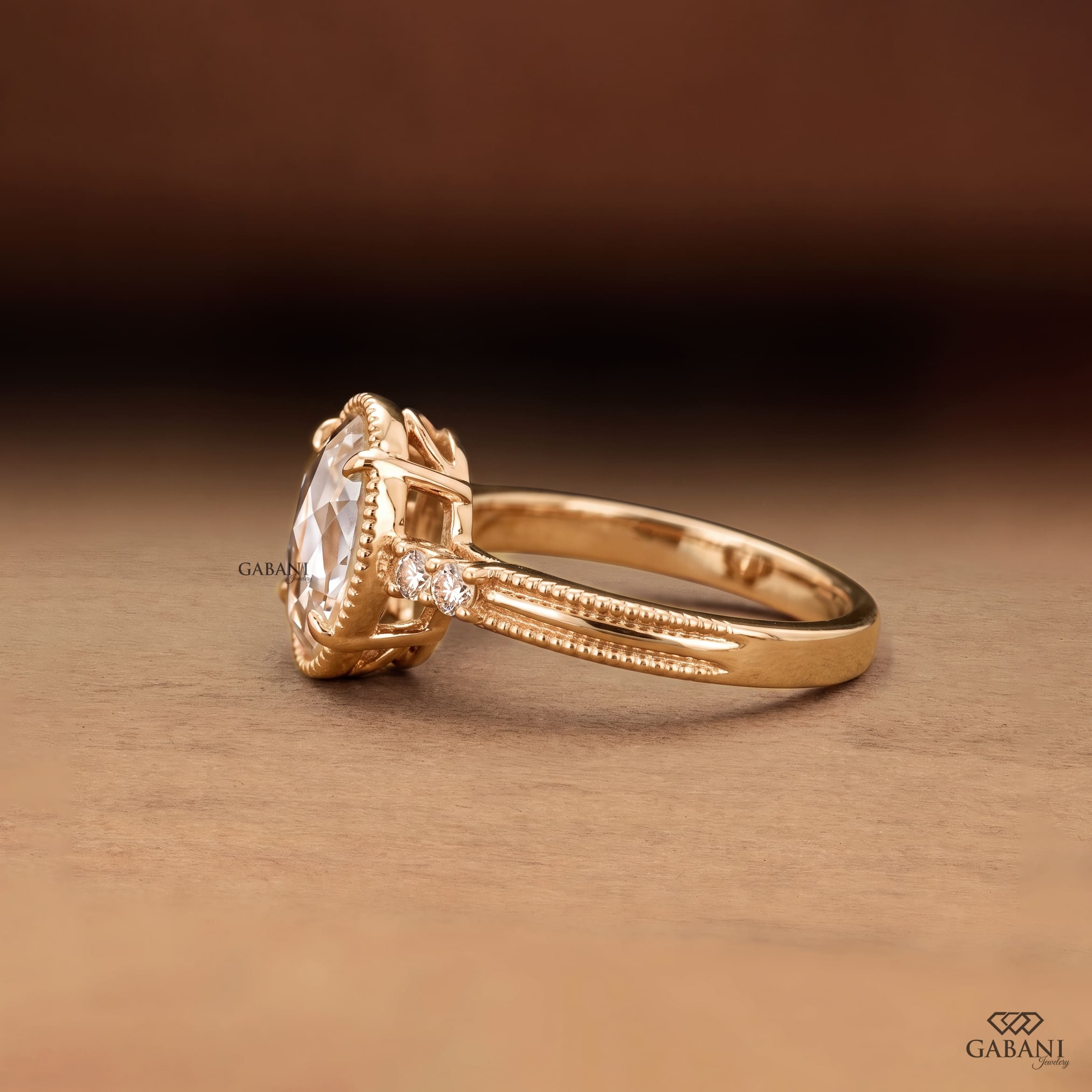 Oval rose cut lab grown diamond engagement ring with round side diamonds, vintage milgrain detailing and split shank design.