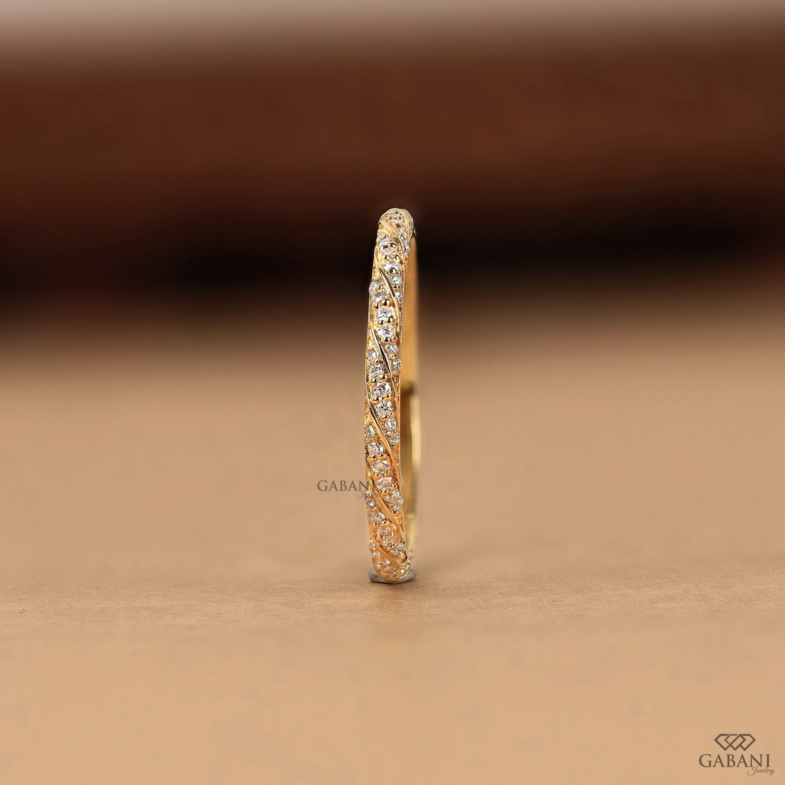 a vintage-inspired lab grown diamond wedding band featuring flowing yellow gold vine curves, round diamond accents and fine milgrain edges, ideal for bridal stacking and anniversaries.