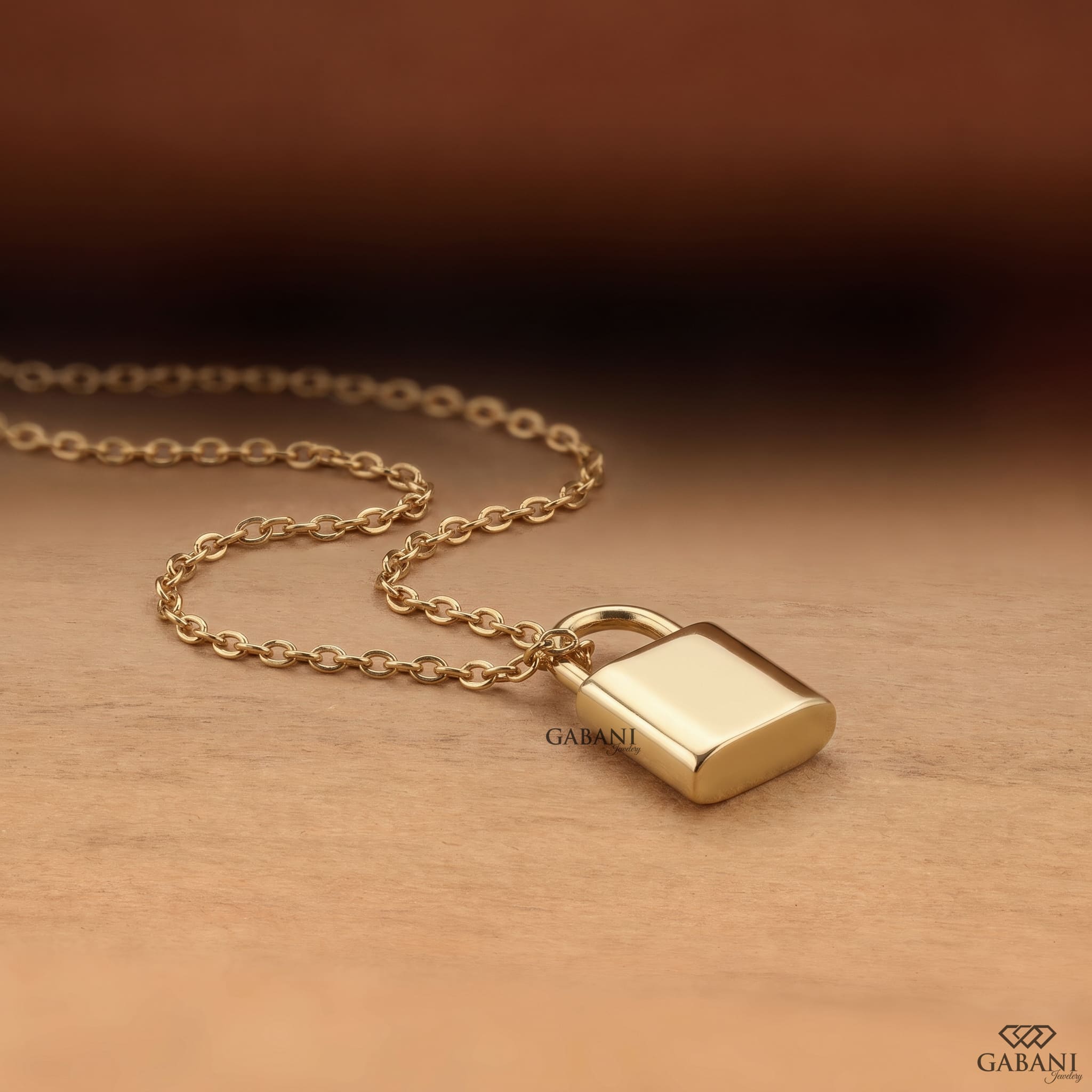 Yellow gold padlock pendant necklace featuring rows of round cut lab grown diamonds in a pavé setting with a polished gold shackle.