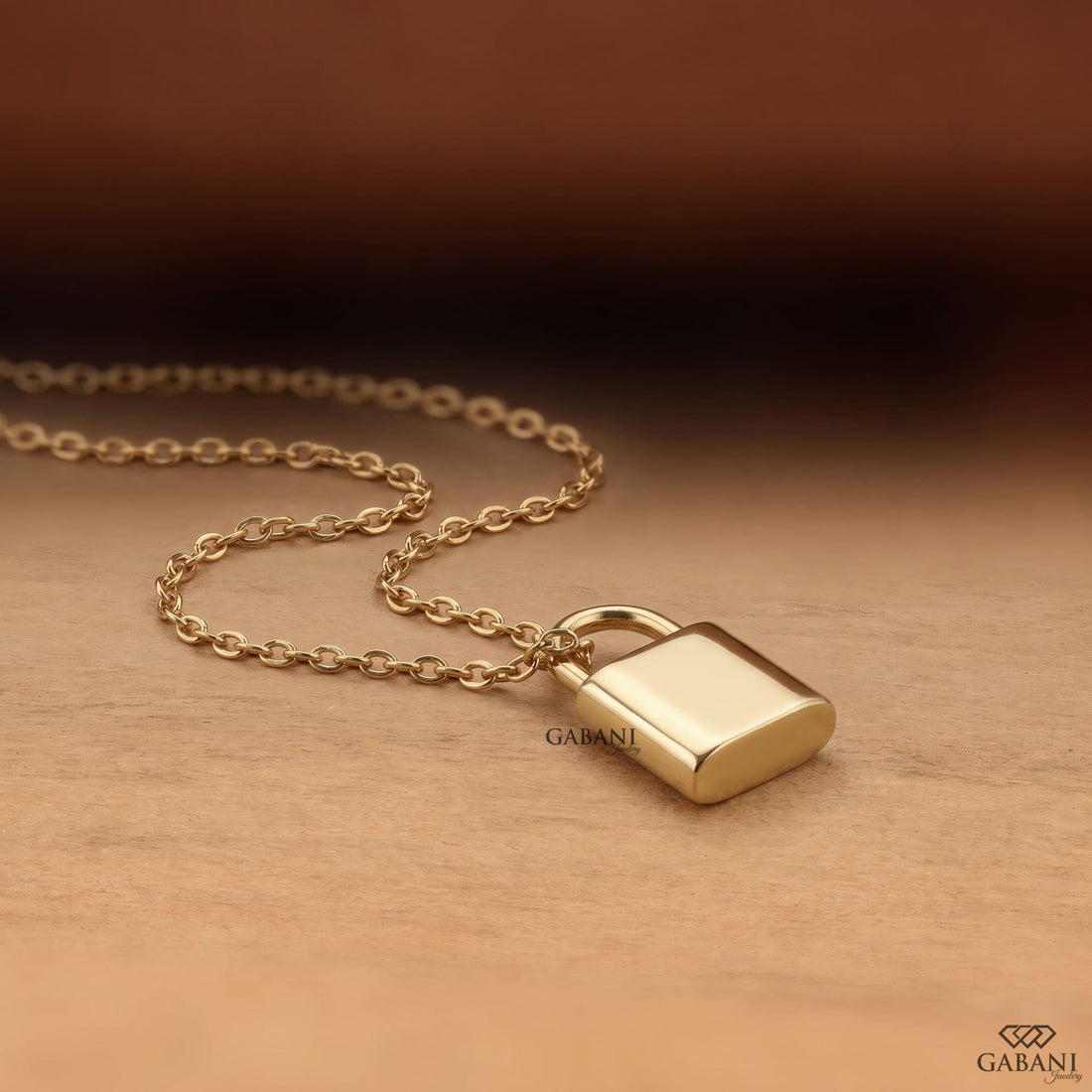 Yellow gold padlock pendant necklace featuring rows of round cut lab grown diamonds in a pavé setting with a polished gold shackle.