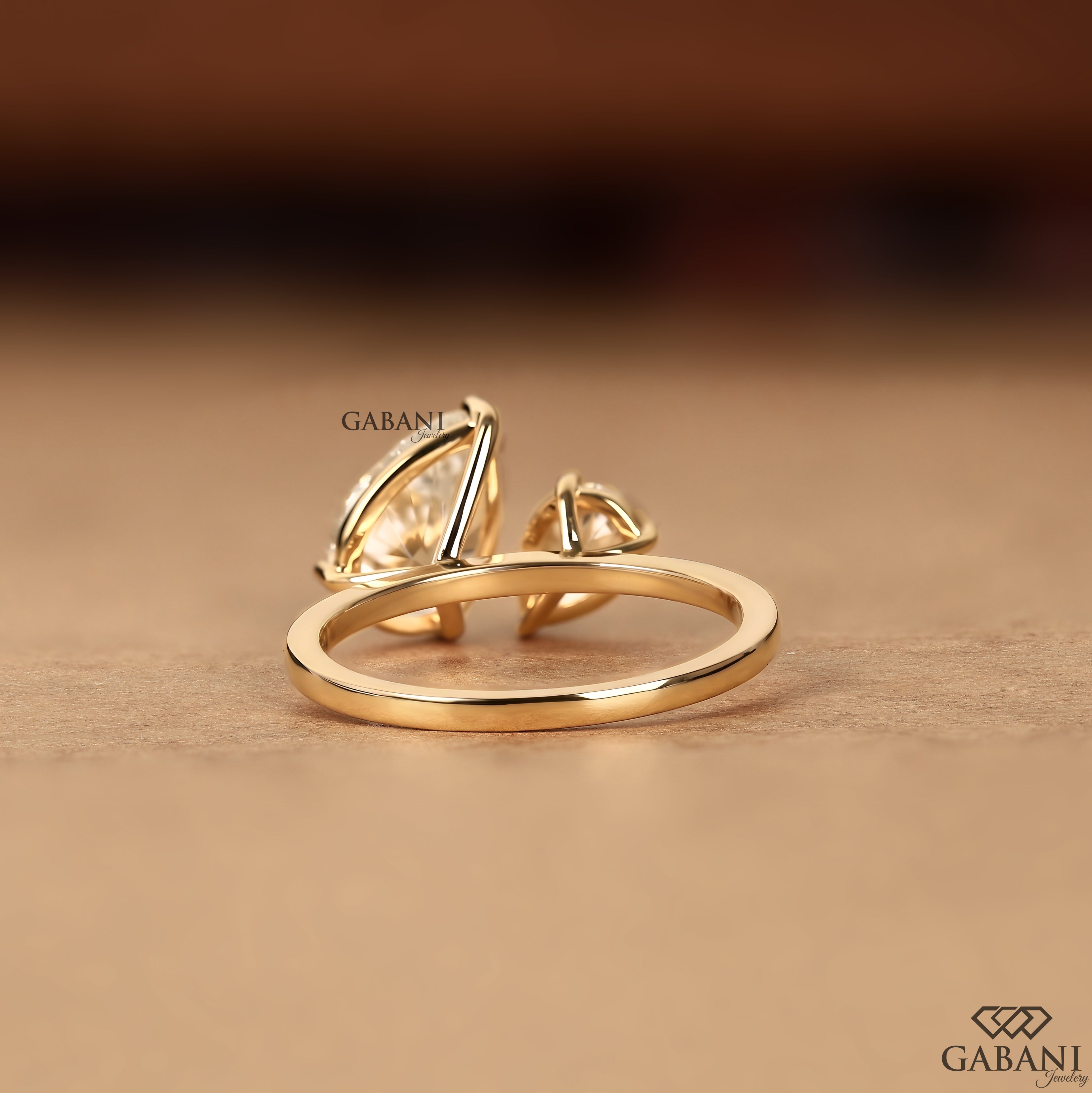 Pear cut lab grown diamond ring with asymmetrical two stone style