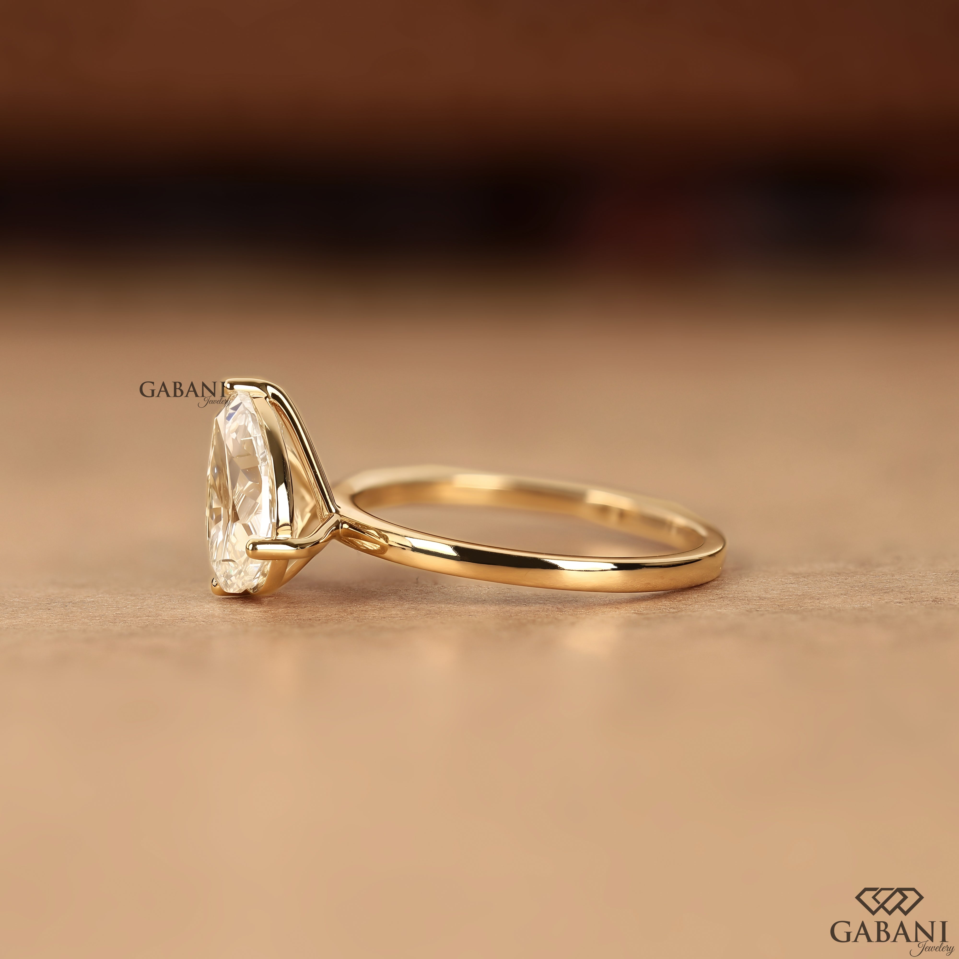 Pear shaped lab grown diamond engagement ring with two stone design
