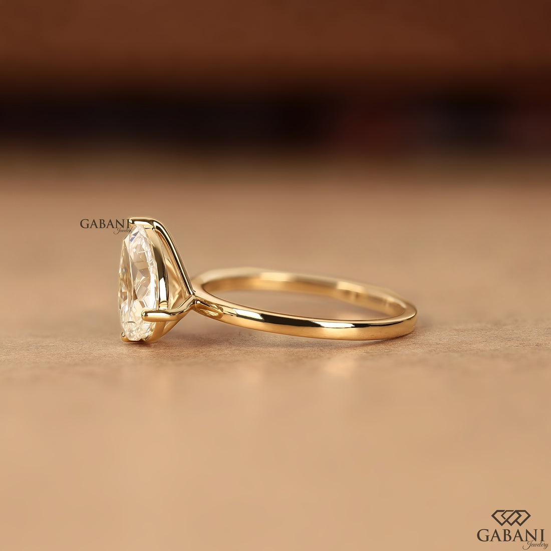 Pear shaped lab grown diamond engagement ring with two stone design