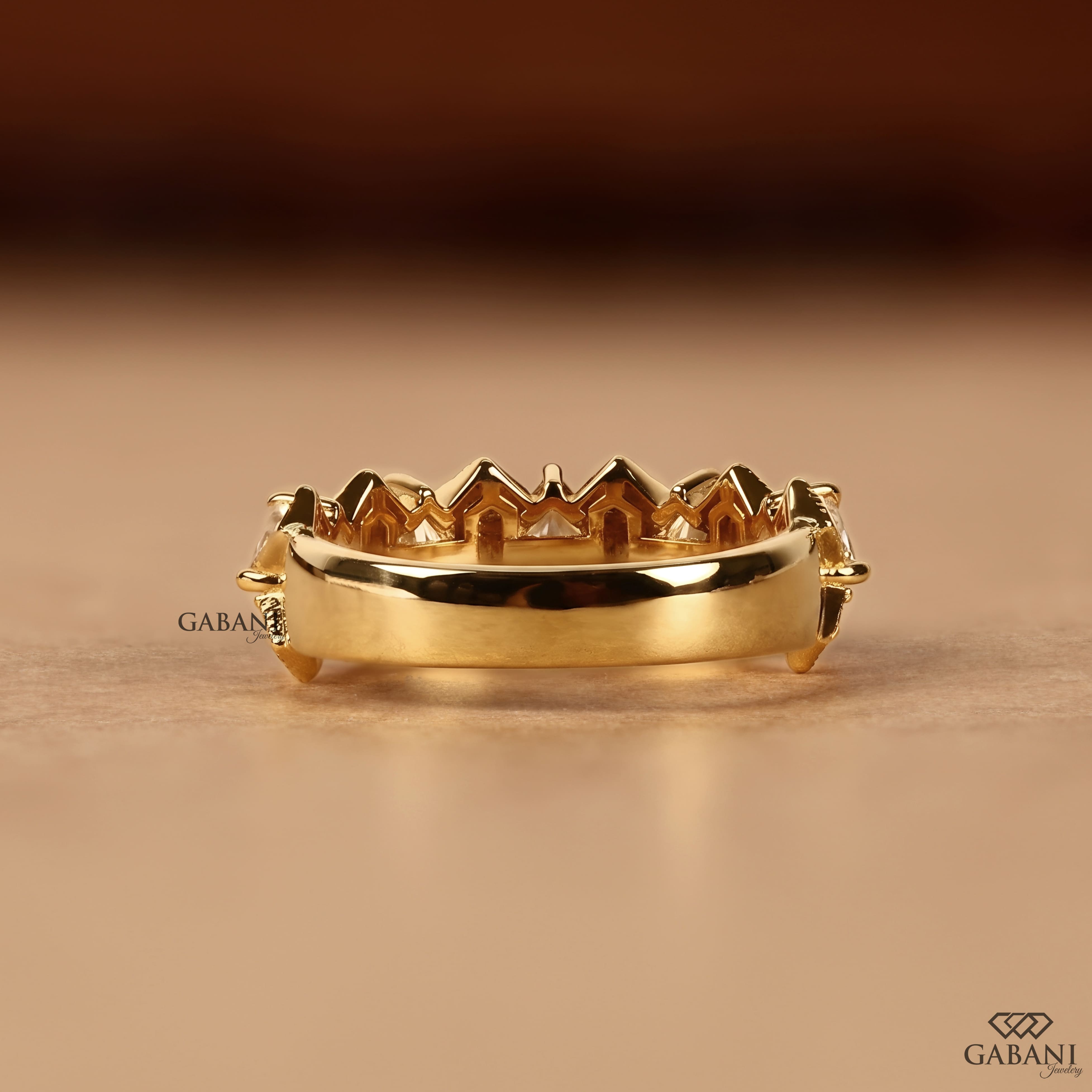 Princess cut lab grown diamond wedding band in yellow gold with round diamond accents and a geometric half eternity design for bridal and anniversary wear.