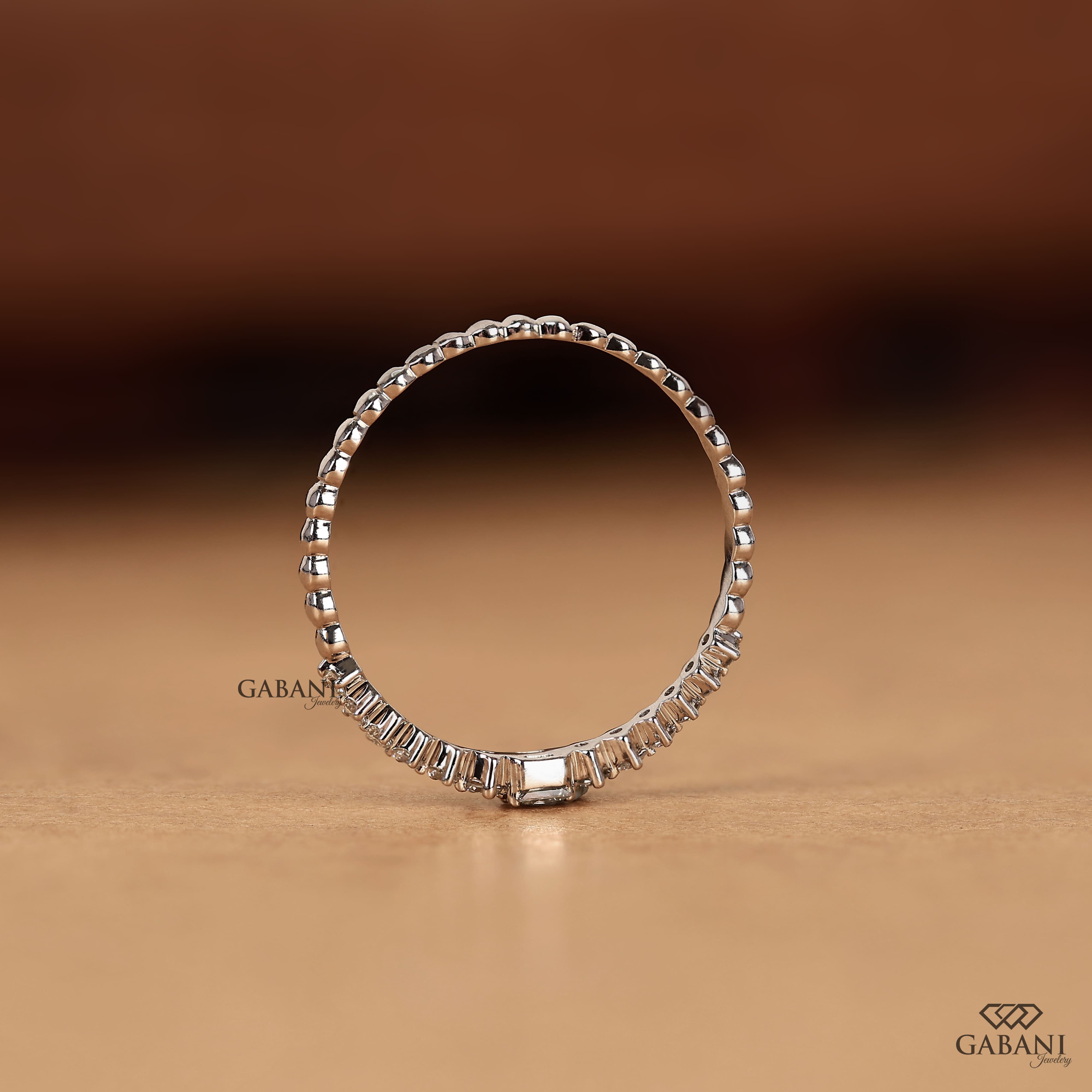 Princess cut and round lab grown diamond wedding band in white gold with graduated prong set diamond design.