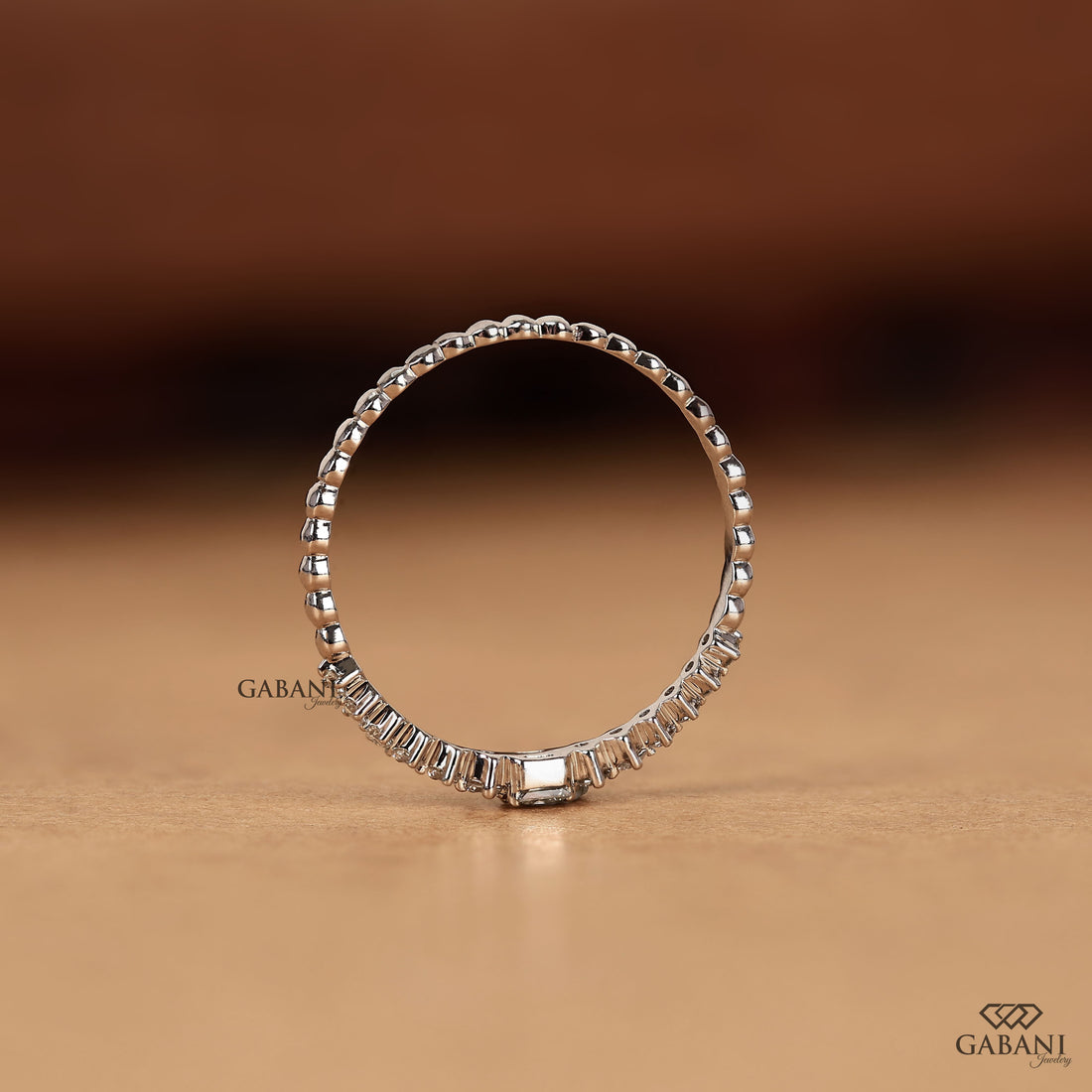 Princess cut and round lab grown diamond wedding band in white gold with graduated prong set diamond design.