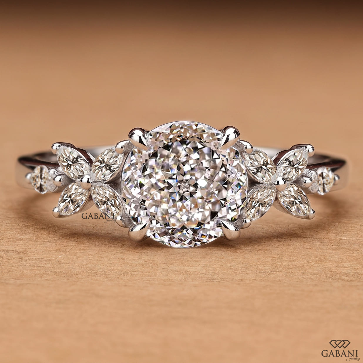 Round Portuguese cut lab grown diamond engagement ring with marquise leaf side stones in polished white gold.