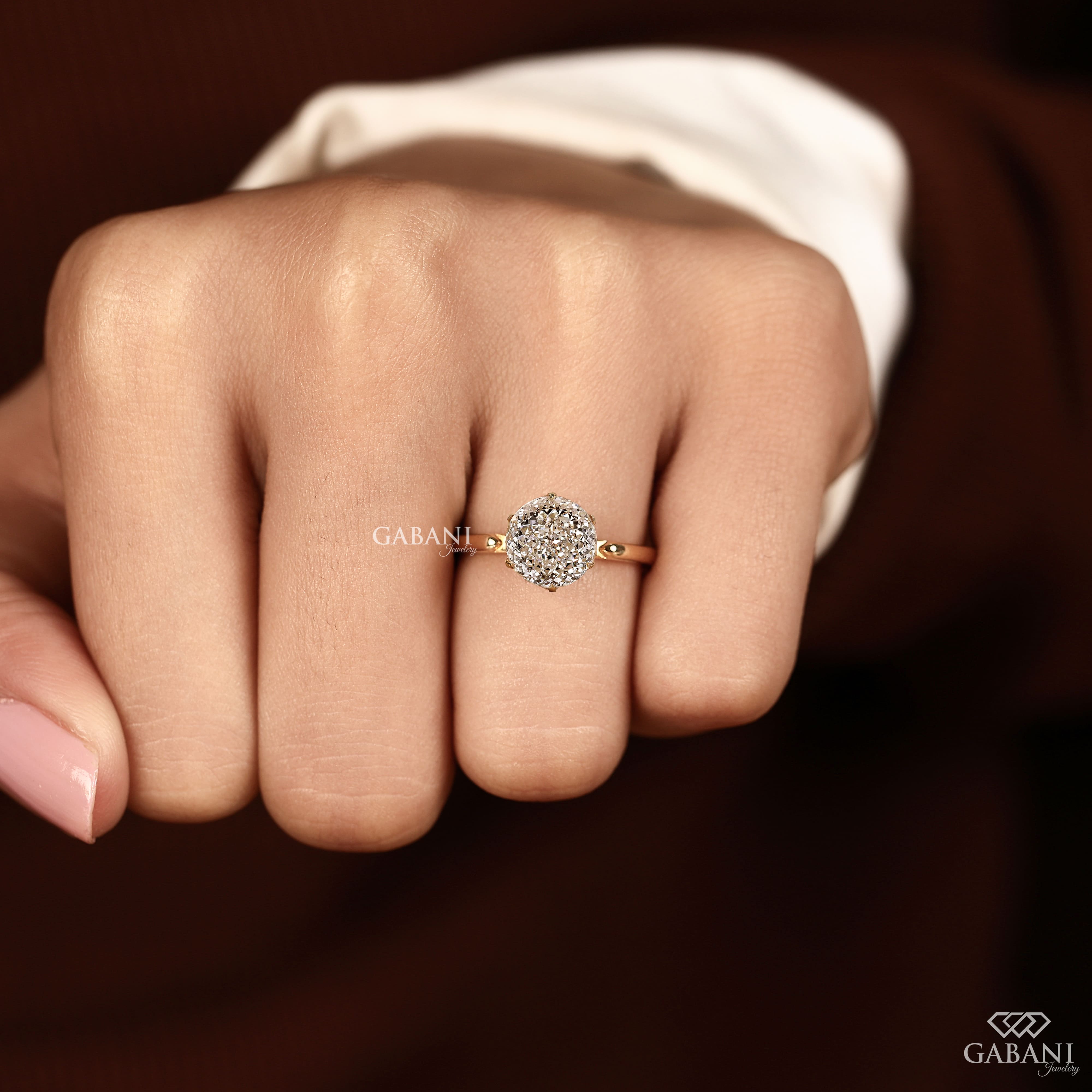 Round Portuguese cut lab grown diamond solitaire engagement ring in yellow gold with a six-prong tulip basket and polished plain band.