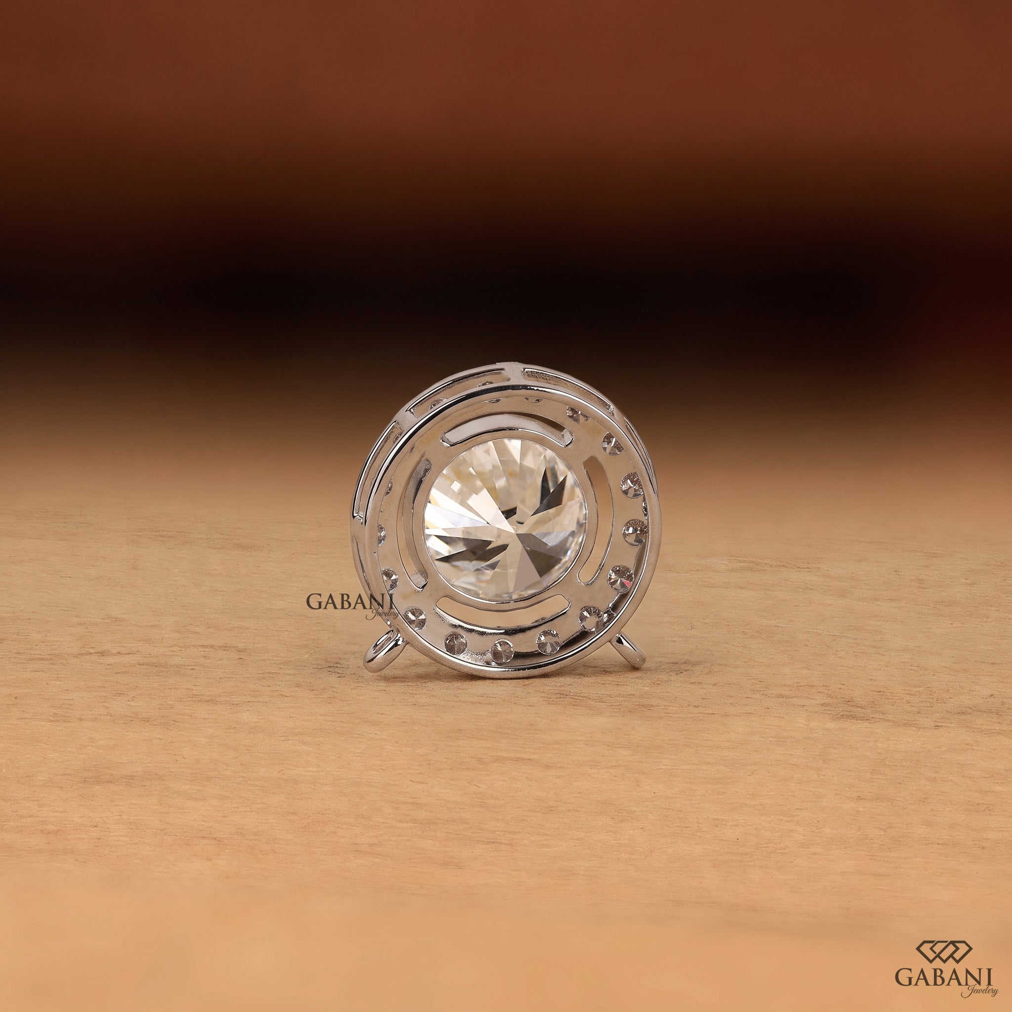 Round cut lab grown diamond floating halo pendant in white gold with a four prong center setting and circular pavé diamond halo.