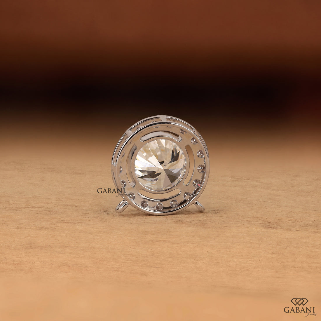 Round cut lab grown diamond floating halo pendant in white gold with a four prong center setting and circular pavé diamond halo.