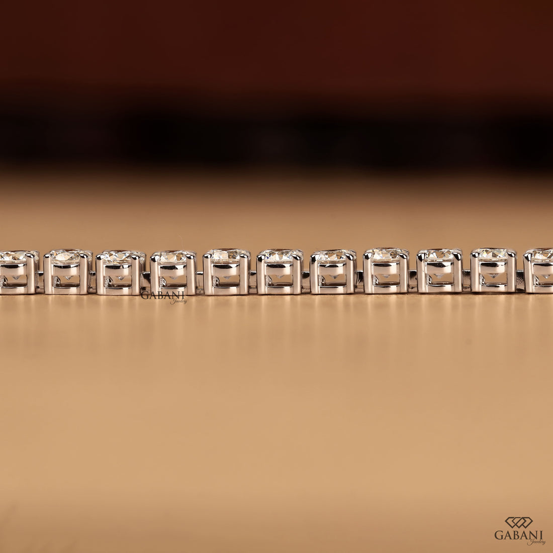 Round cut lab grown diamond tennis bracelet with EF color VS1 clarity diamonds in classic four prong settings and secure clasp.