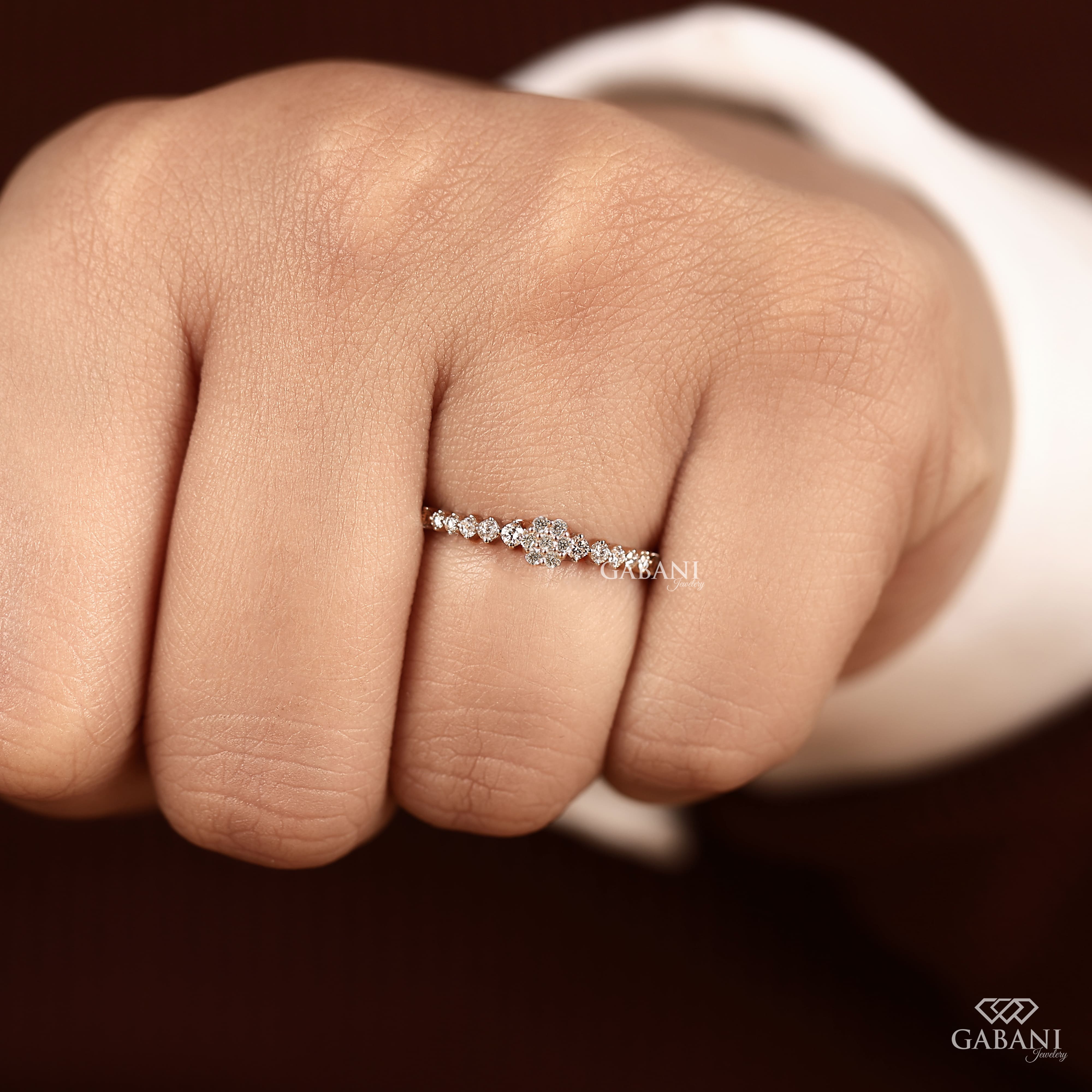 Round lab grown diamond floral cluster wedding band in white gold with graduated side diamonds and prong setting.