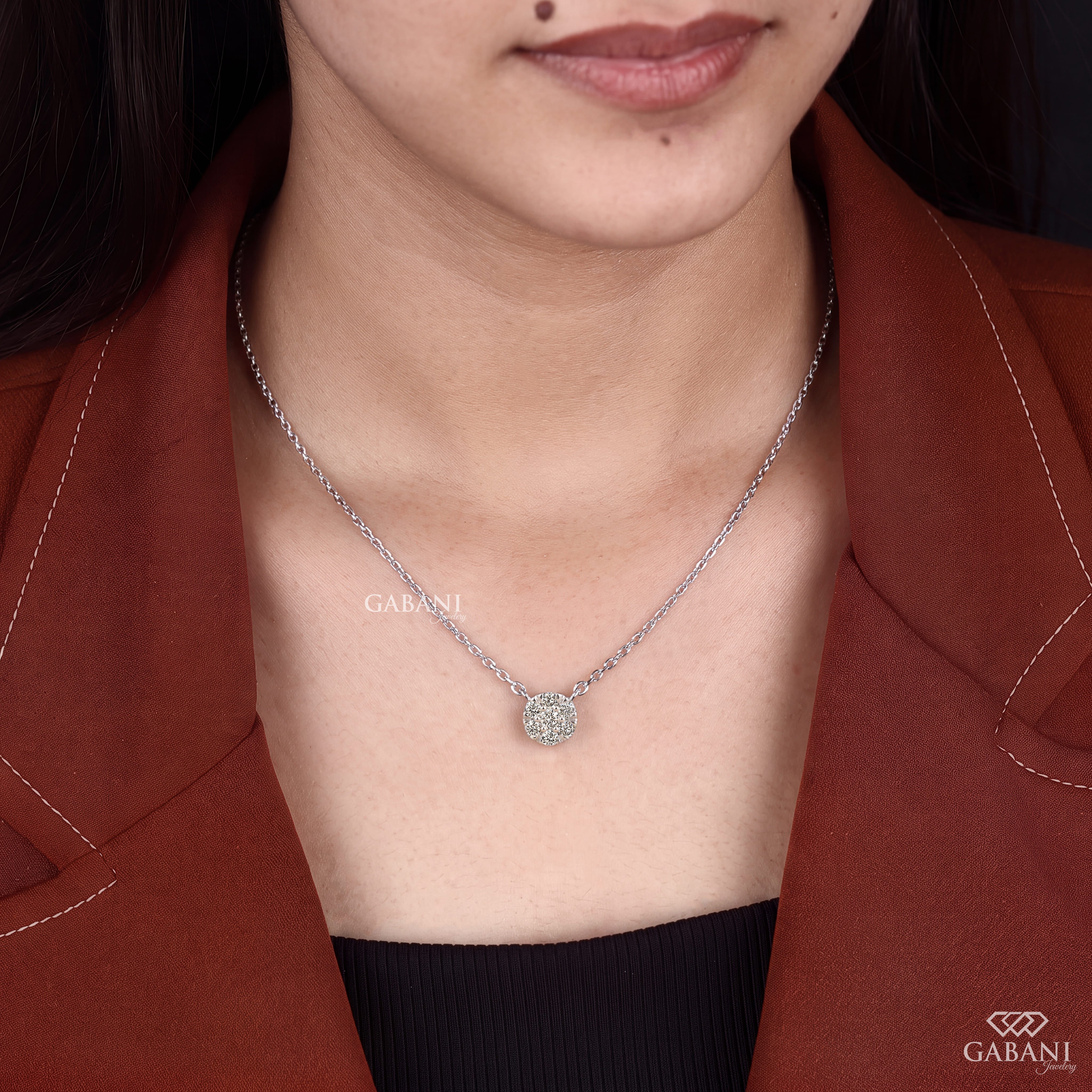 Seven stone round cut lab grown diamond floral cluster necklace in 18K white gold with a delicate cable chain and prong setting.