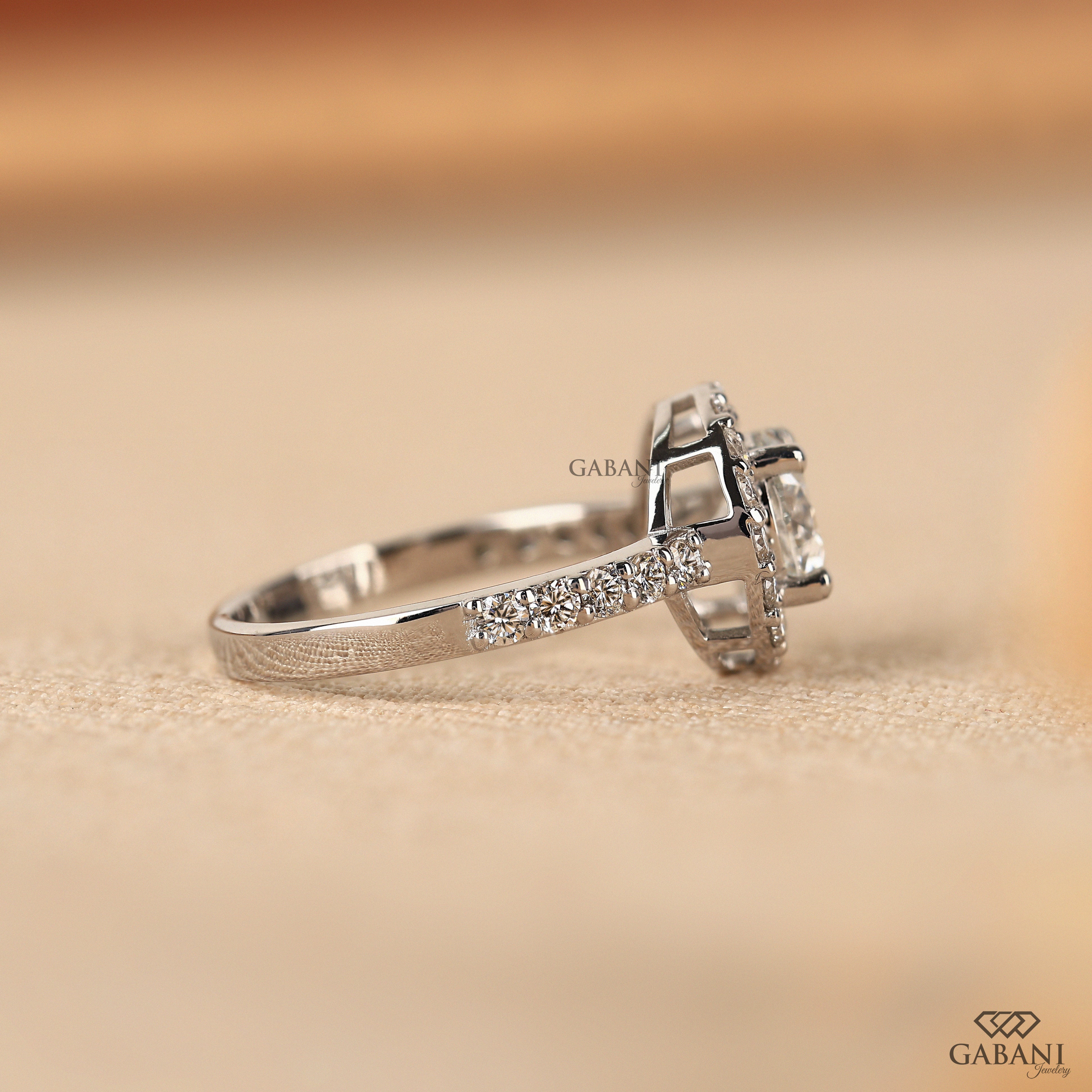 Round cut lab grown diamond halo engagement ring with pave diamond band, yellow gold setting, IGI certified EF color VS1 clarity.