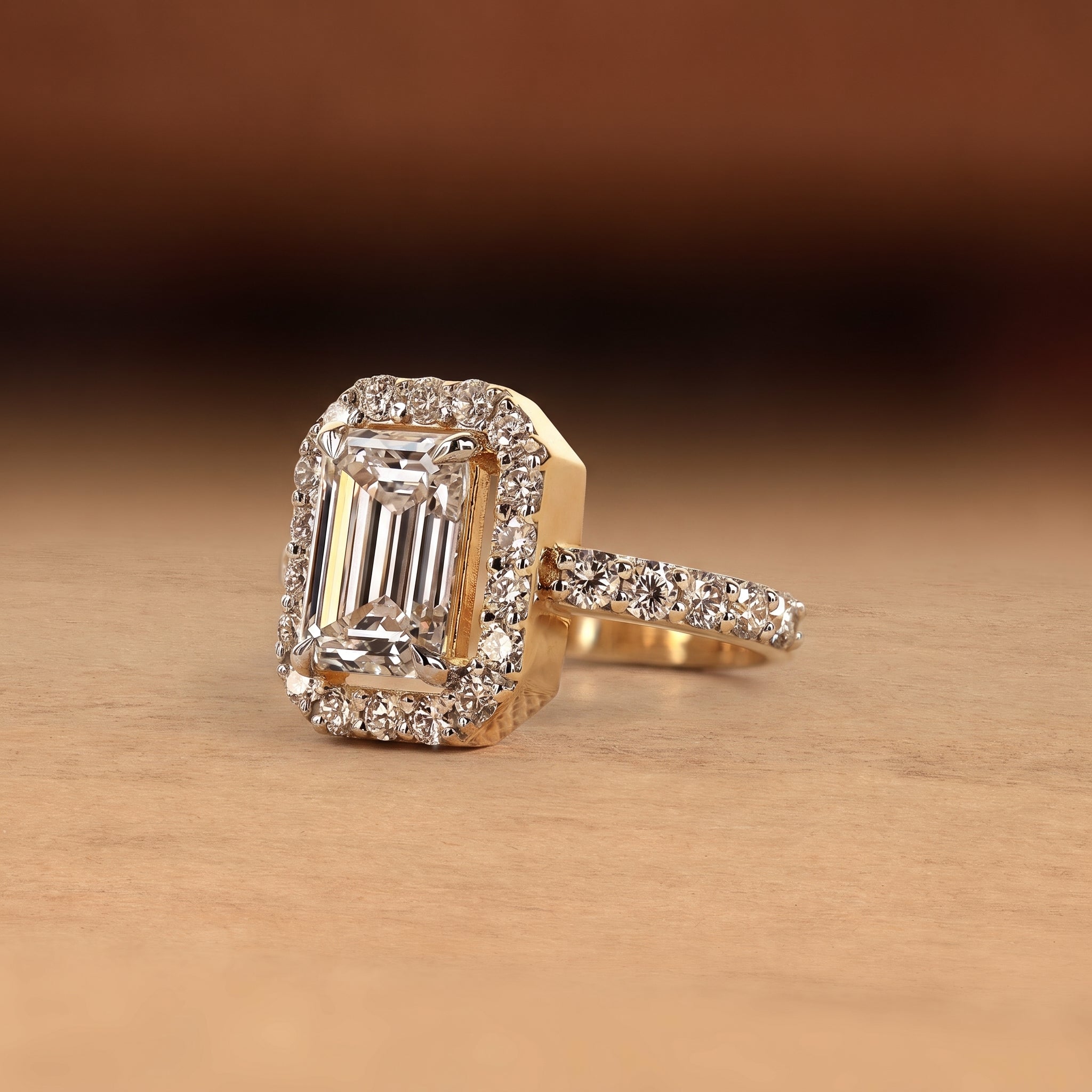 Emerald cut lab grown diamond engagement ring with round diamond halo, pave side stones, yellow gold band, IGI certified EF color VS1 clarity.