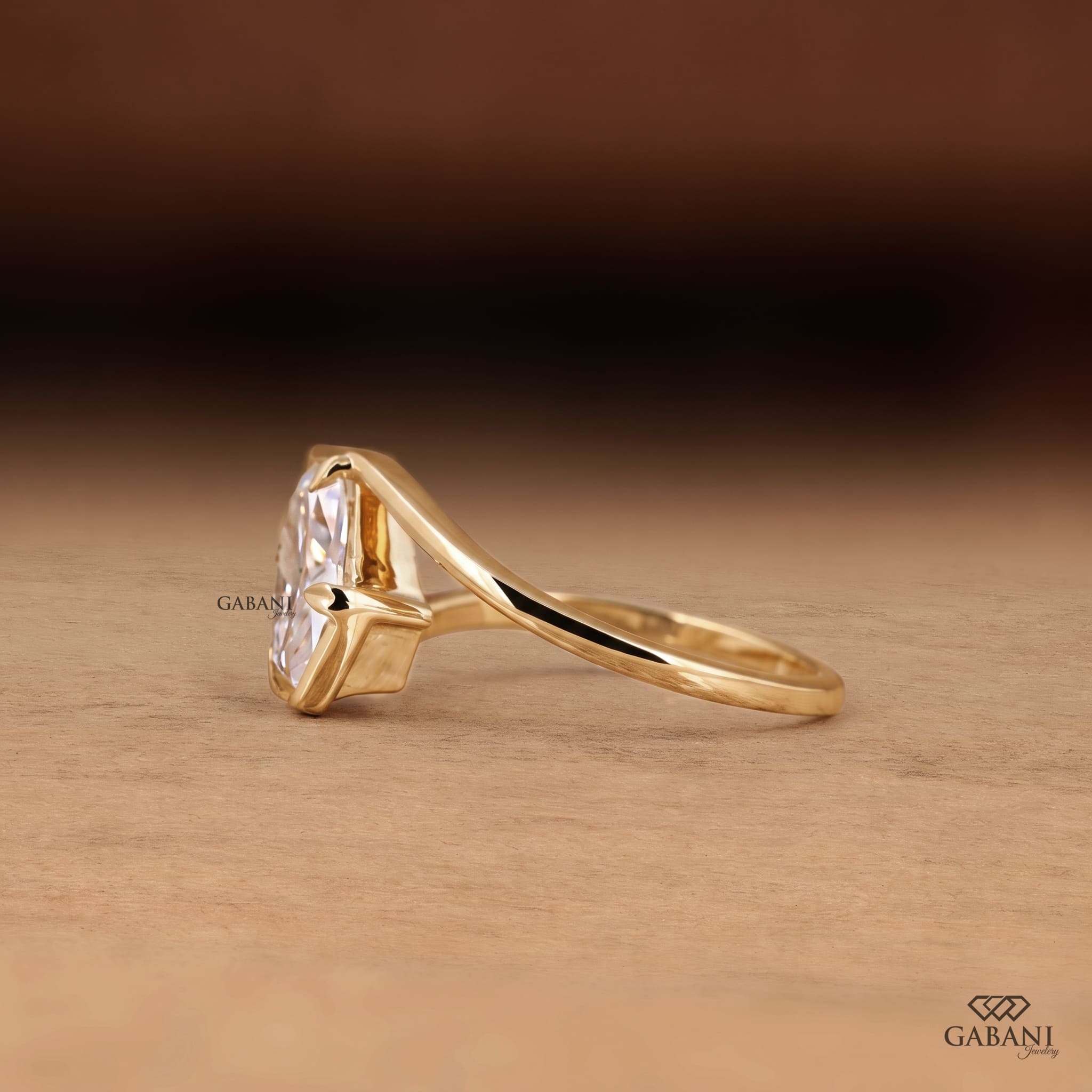  lab grown diamond engagement ring with prong setting, modern split shank design and polished yellow gold band.
