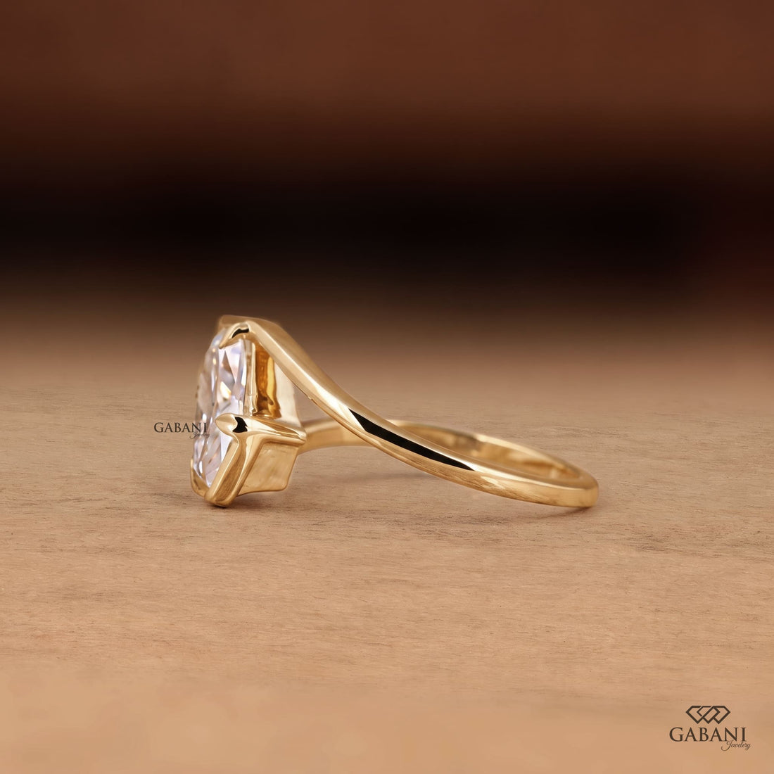  lab grown diamond engagement ring with prong setting, modern split shank design and polished yellow gold band.