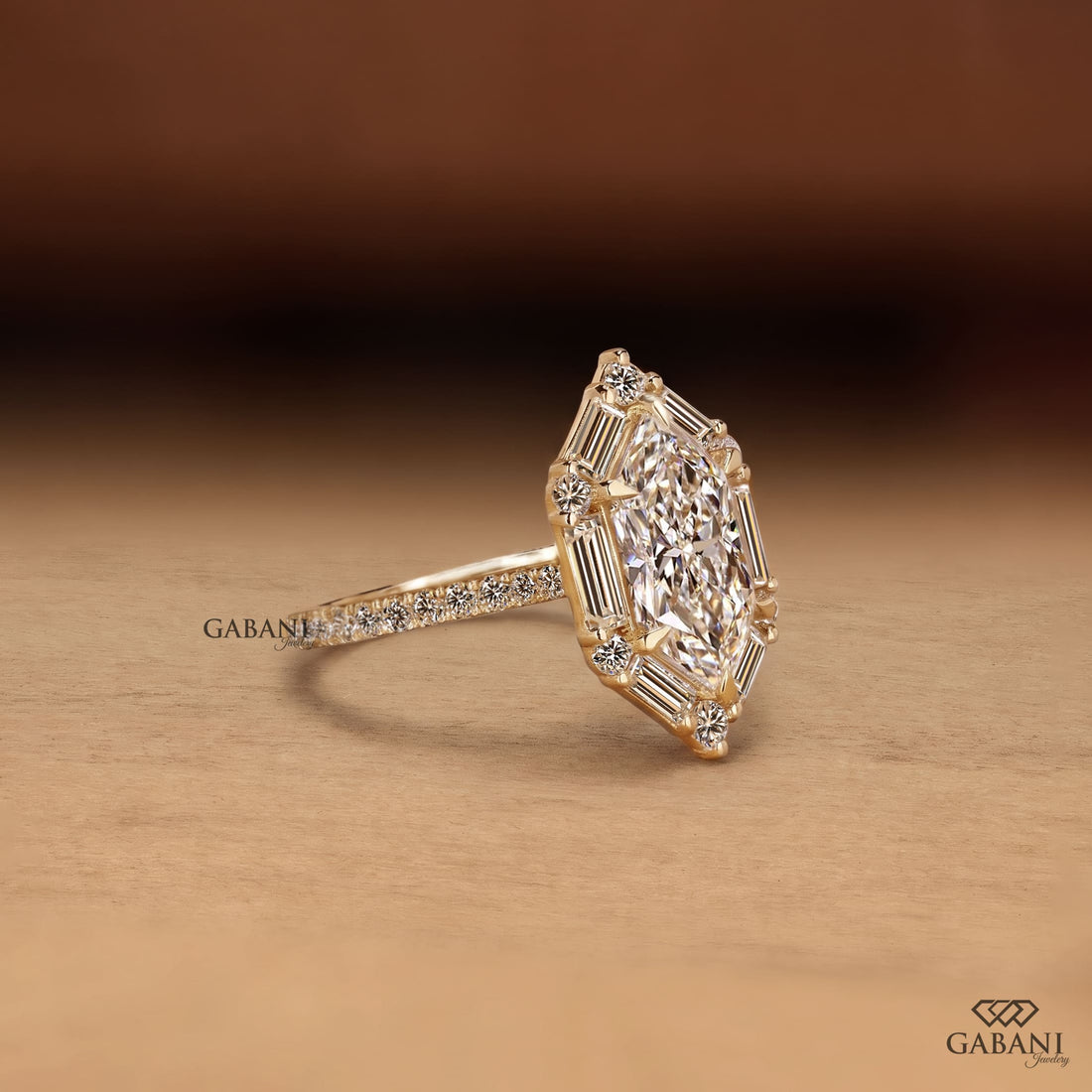 Marquise cut lab grown diamond engagement ring with baguette and round diamond accents, pavé band and yellow gold setting.