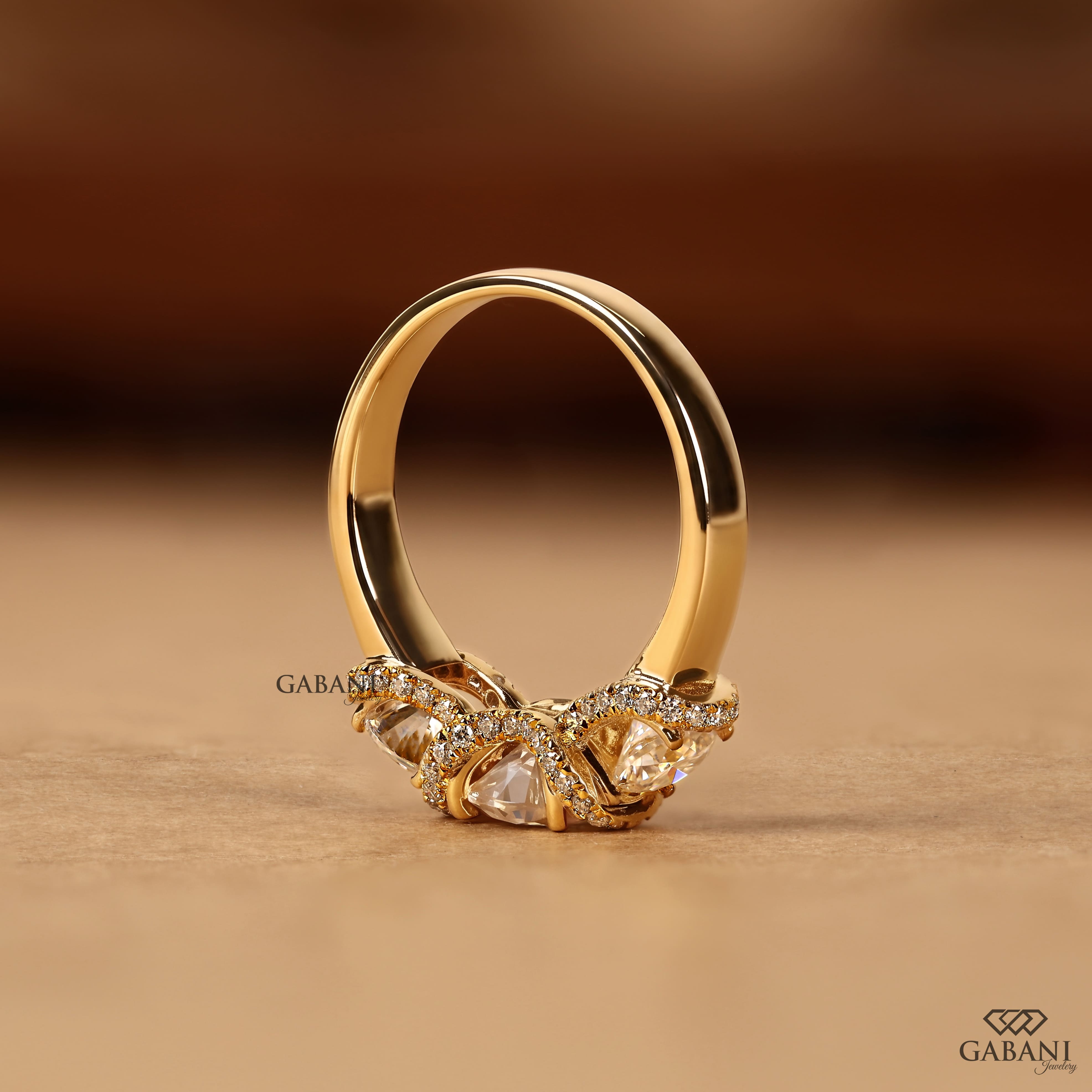 1.5 to 2 carat lab grown diamond engagement ring with cushion and pear cuts