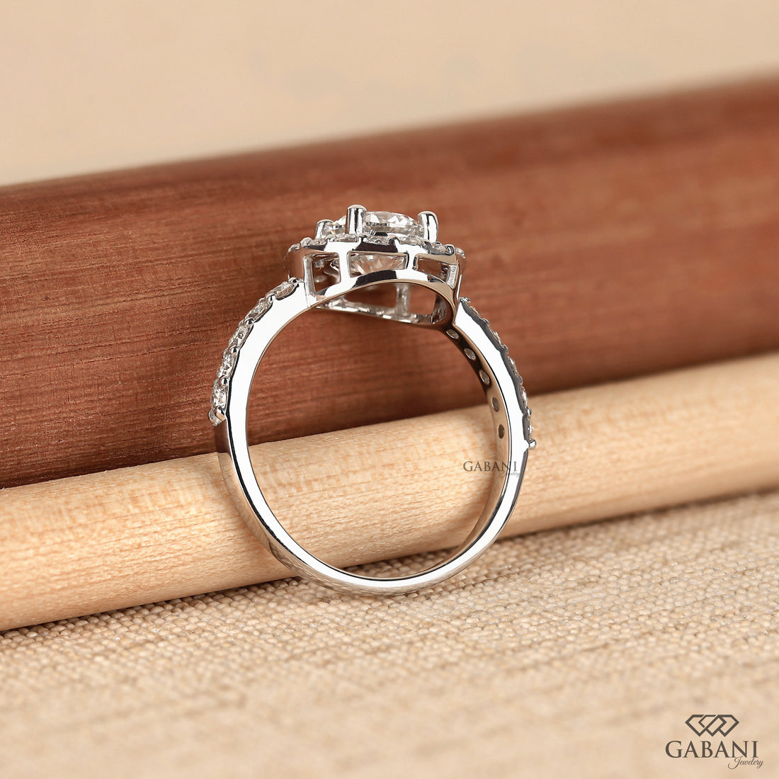 Round cut lab grown diamond halo engagement ring with pave diamond band, yellow gold setting, IGI certified EF color VS1 clarity.