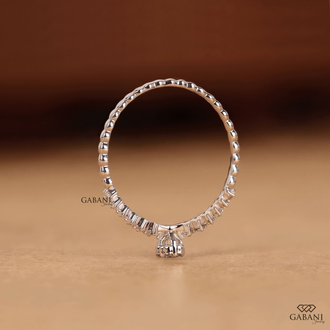 Round lab grown diamond floral cluster wedding band in white gold with graduated side diamonds and prong setting.