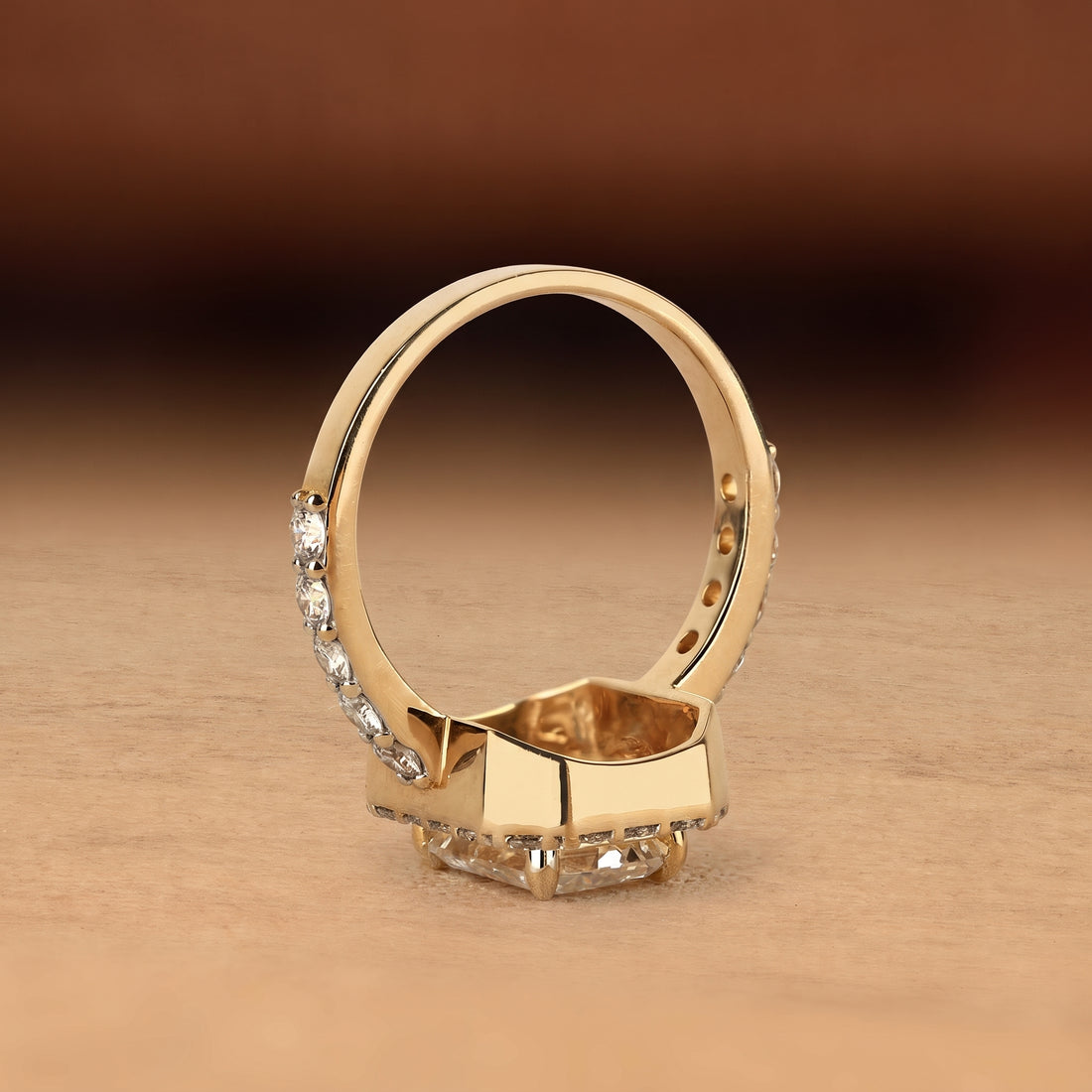 Emerald cut lab grown diamond engagement ring with round diamond halo, pave side stones, yellow gold band, IGI certified EF color VS1 clarity.