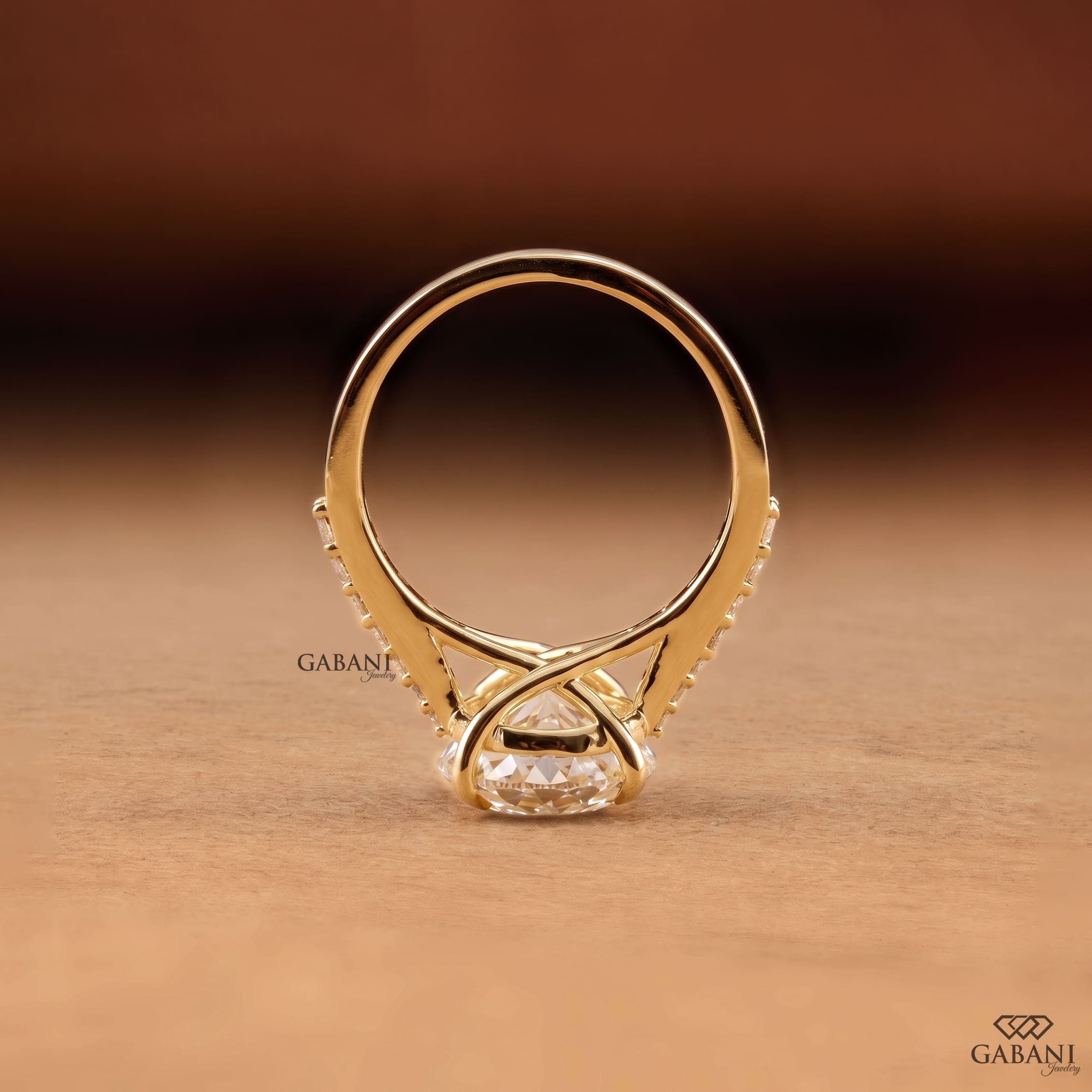 Round Portuguese cut lab grown diamond cathedral engagement ring in yellow gold with a four-prong center setting and pave diamond shoulders.