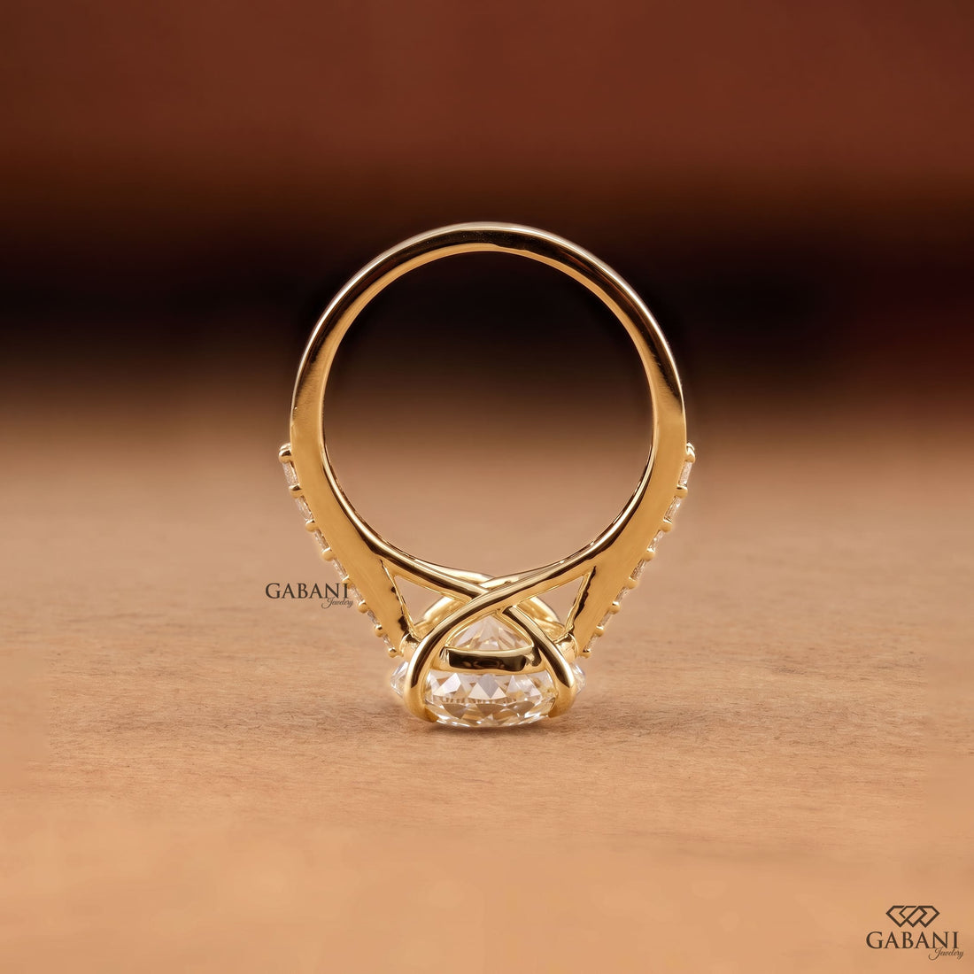 Round Portuguese cut lab grown diamond cathedral engagement ring in yellow gold with a four-prong center setting and pave diamond shoulders.
