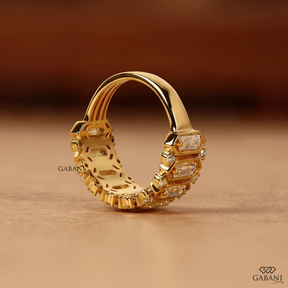Emerald cut lab grown diamond wedding band in yellow gold with round diamond accents and a bold geometric design for bridal, anniversary, and statement wear.