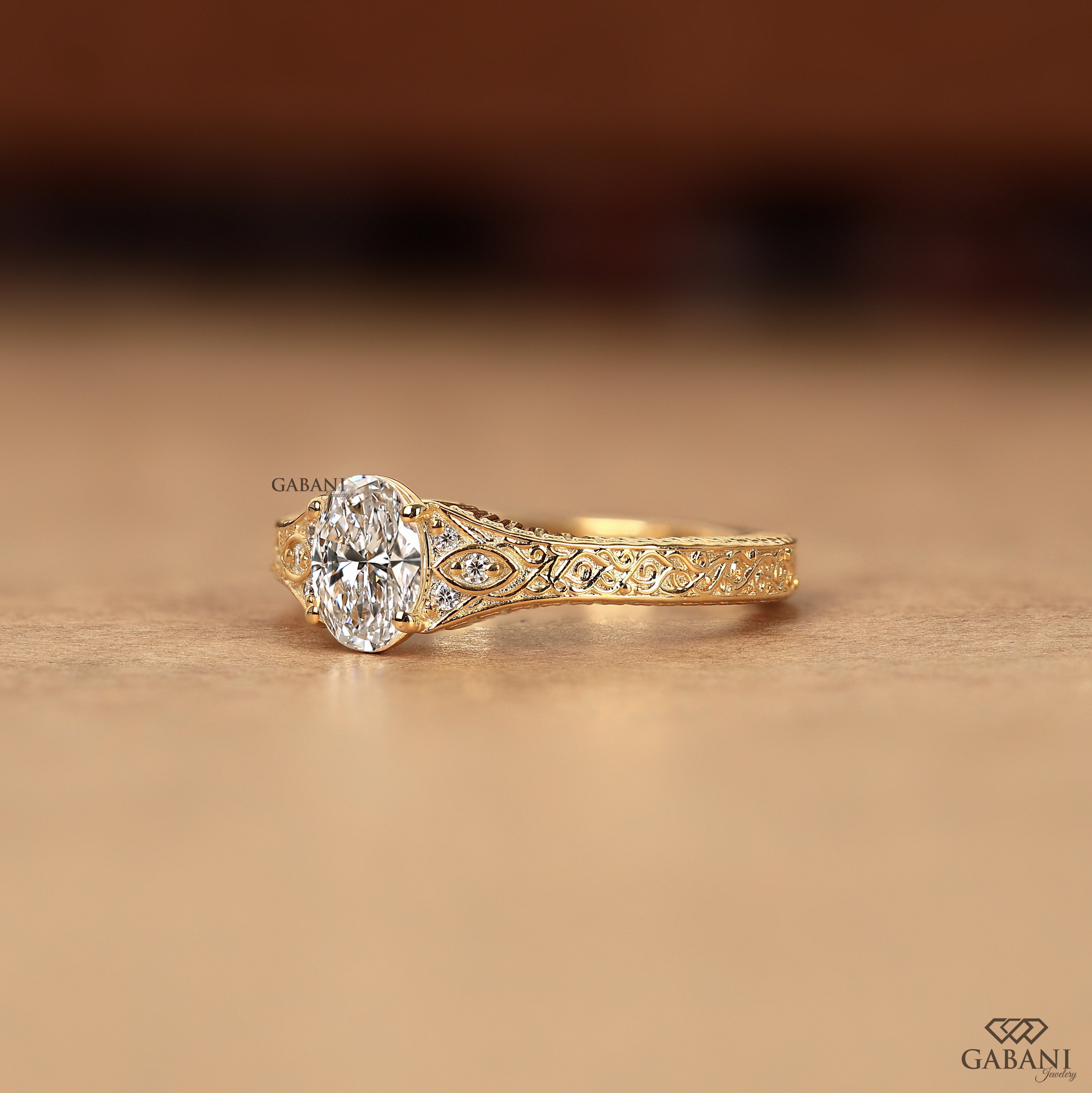 Oval diamond engraved gold engagement ring