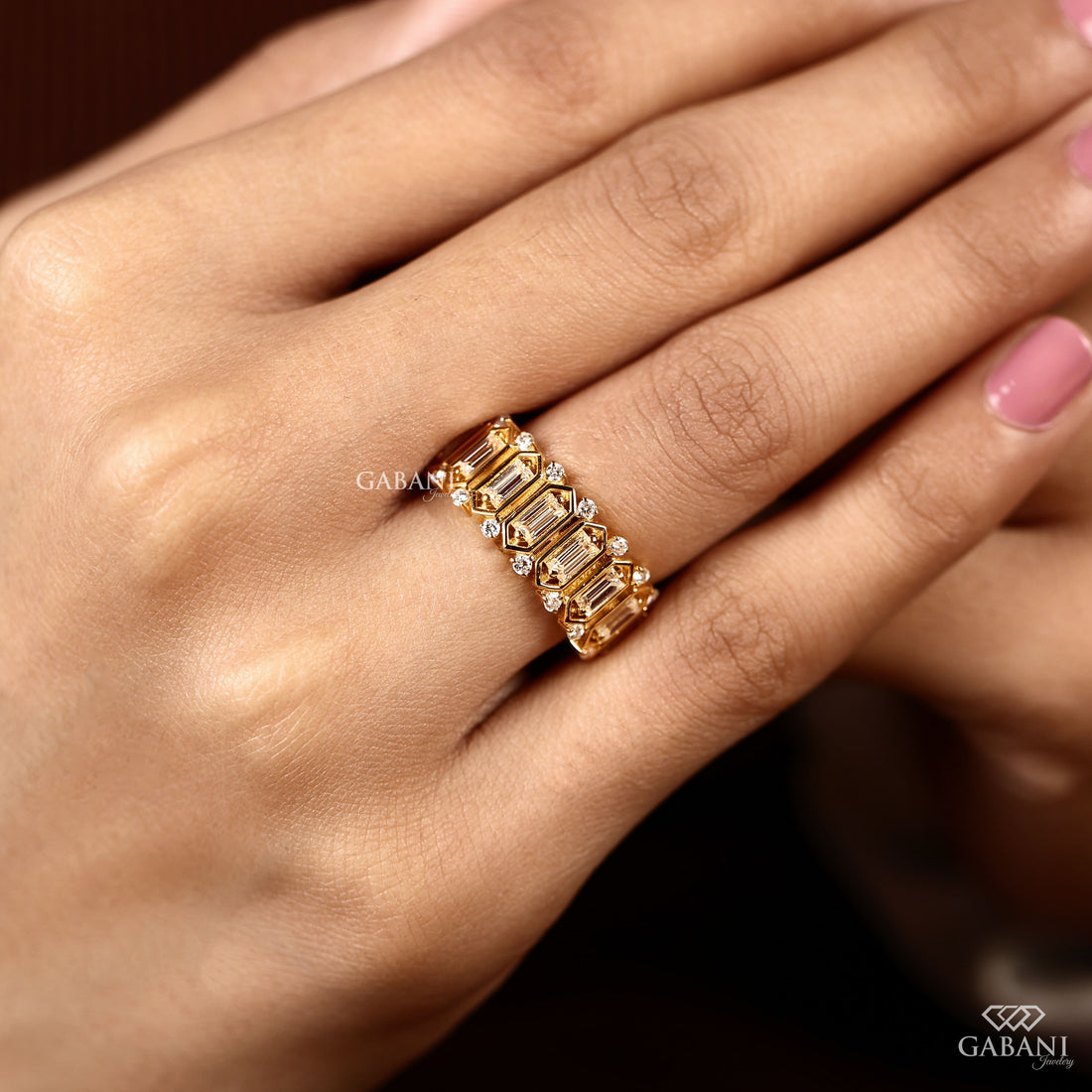 Emerald cut lab grown diamond wedding band in yellow gold with round diamond accents and a bold geometric design for bridal, anniversary, and statement wear.