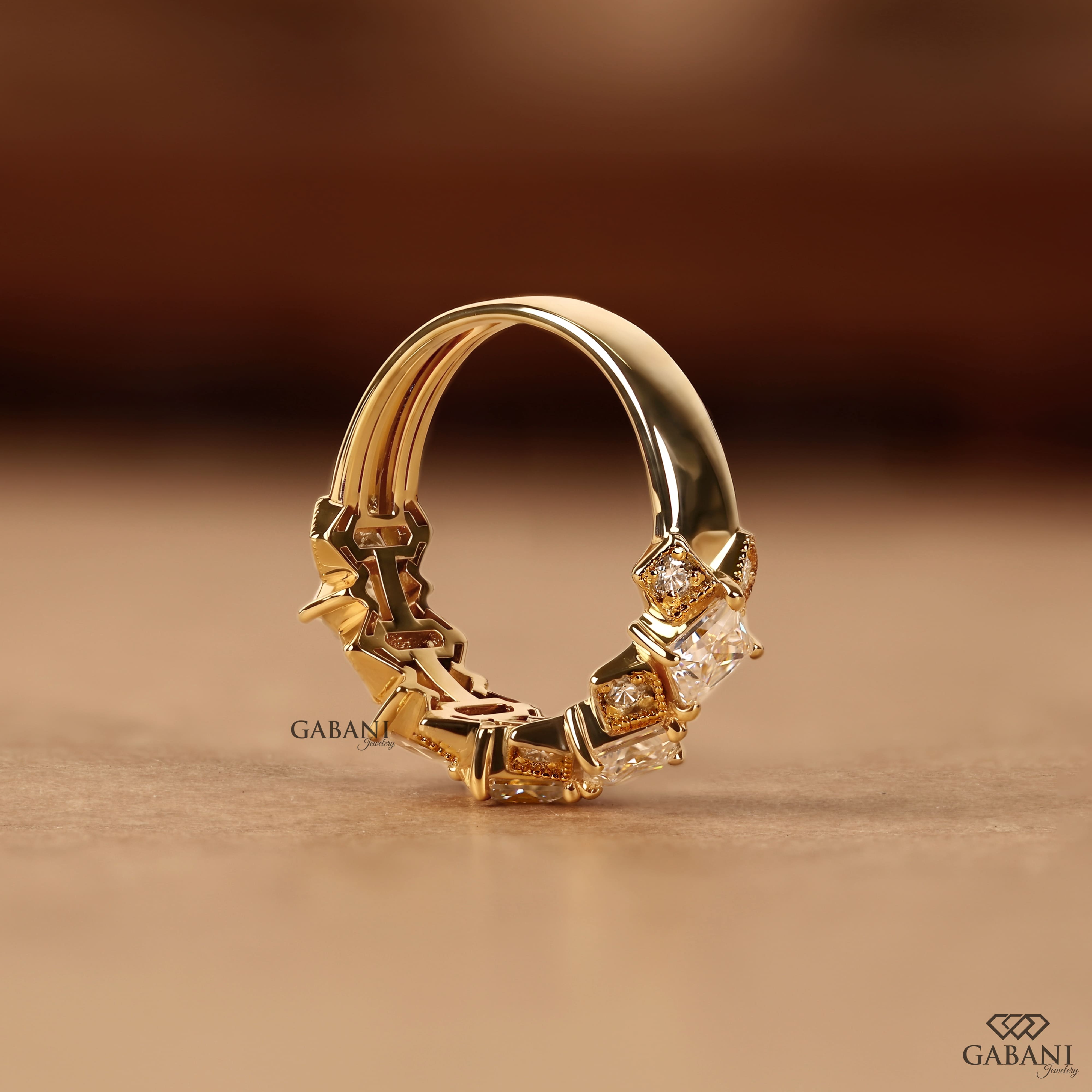 Princess cut lab grown diamond wedding band in yellow gold with round diamond accents and a geometric half eternity design for bridal and anniversary wear.