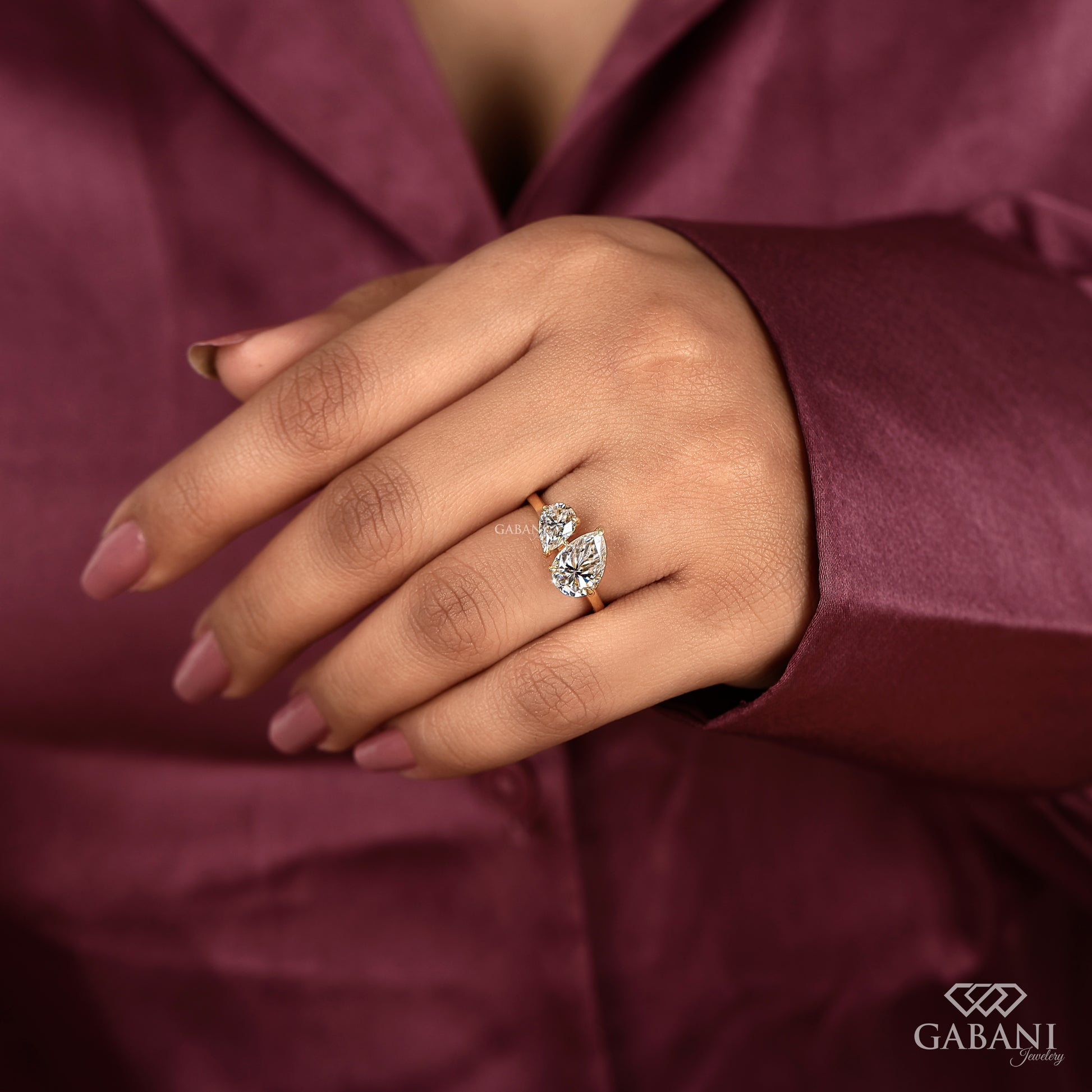 two pear diamond lab grown toi et moi ring in yellow gold with secure prong setting