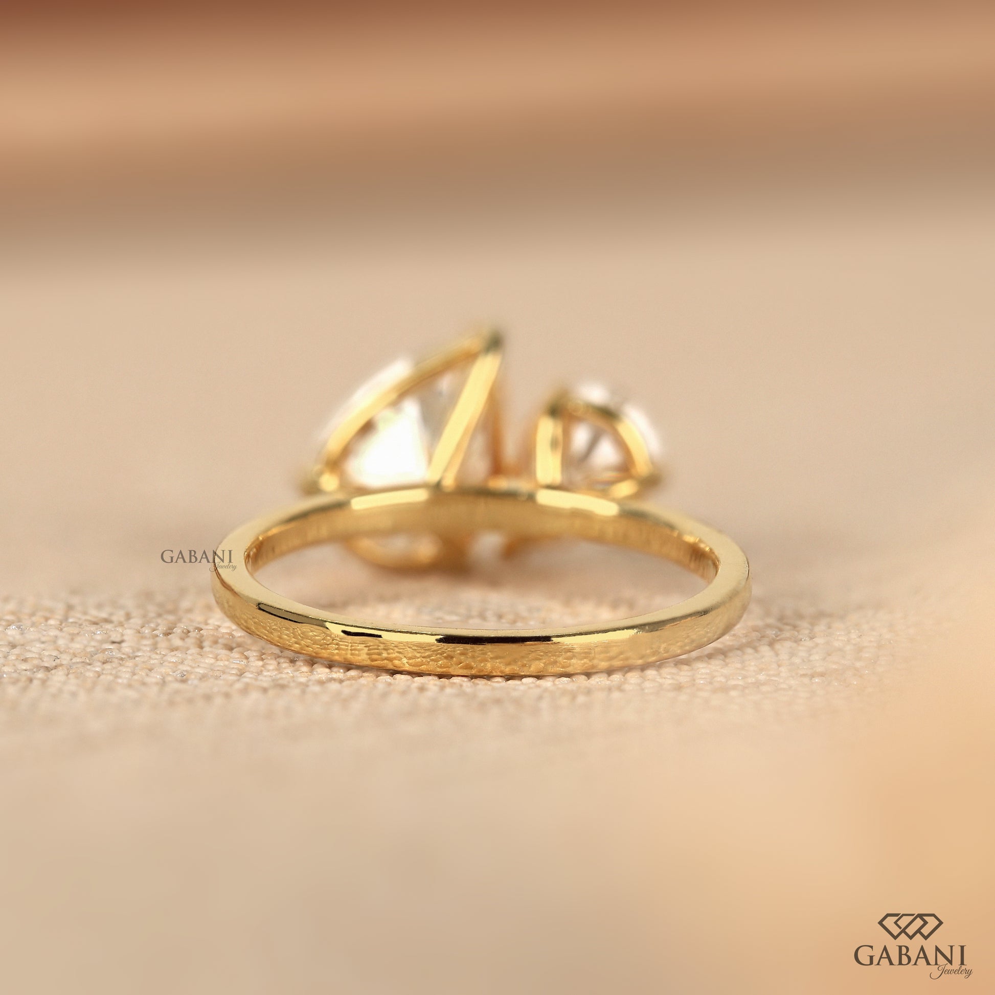 pear cut lab grown diamond you and me ring in solid yellow gold with elegant proportions
