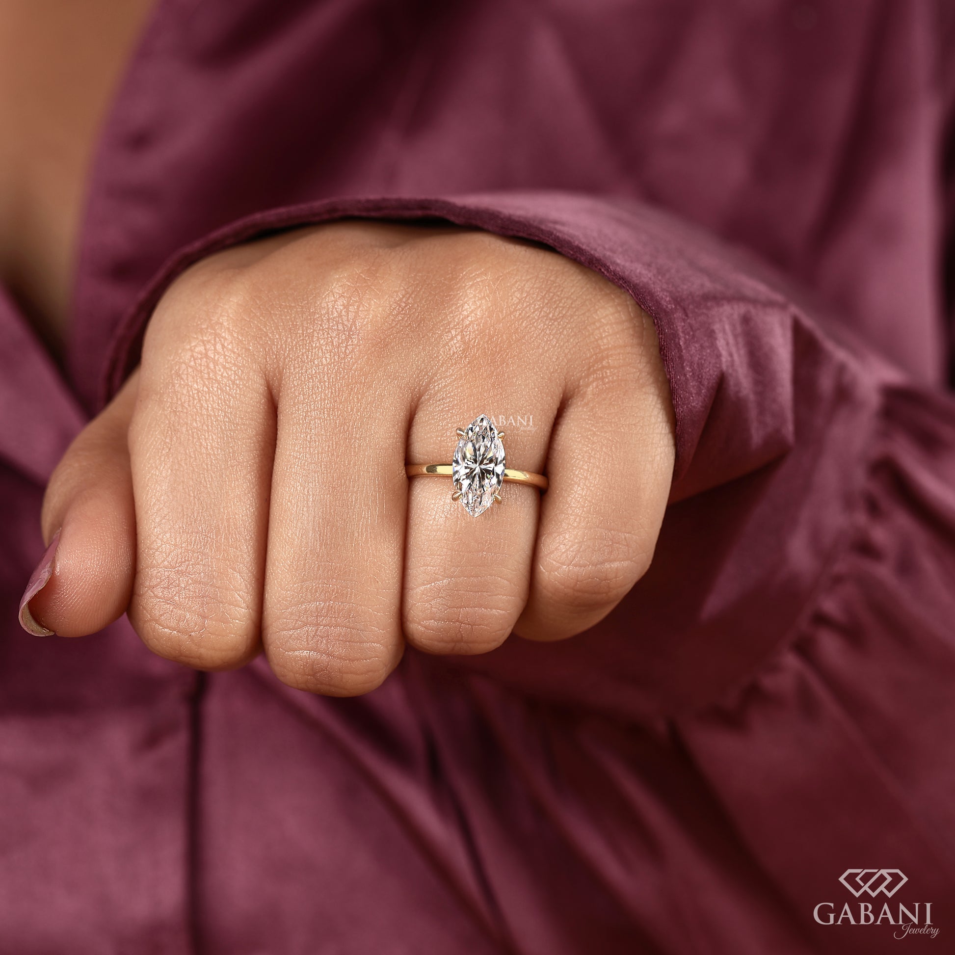 marquise cut lab grown diamond solitaire ring with prong set basket and smooth pipe shank band