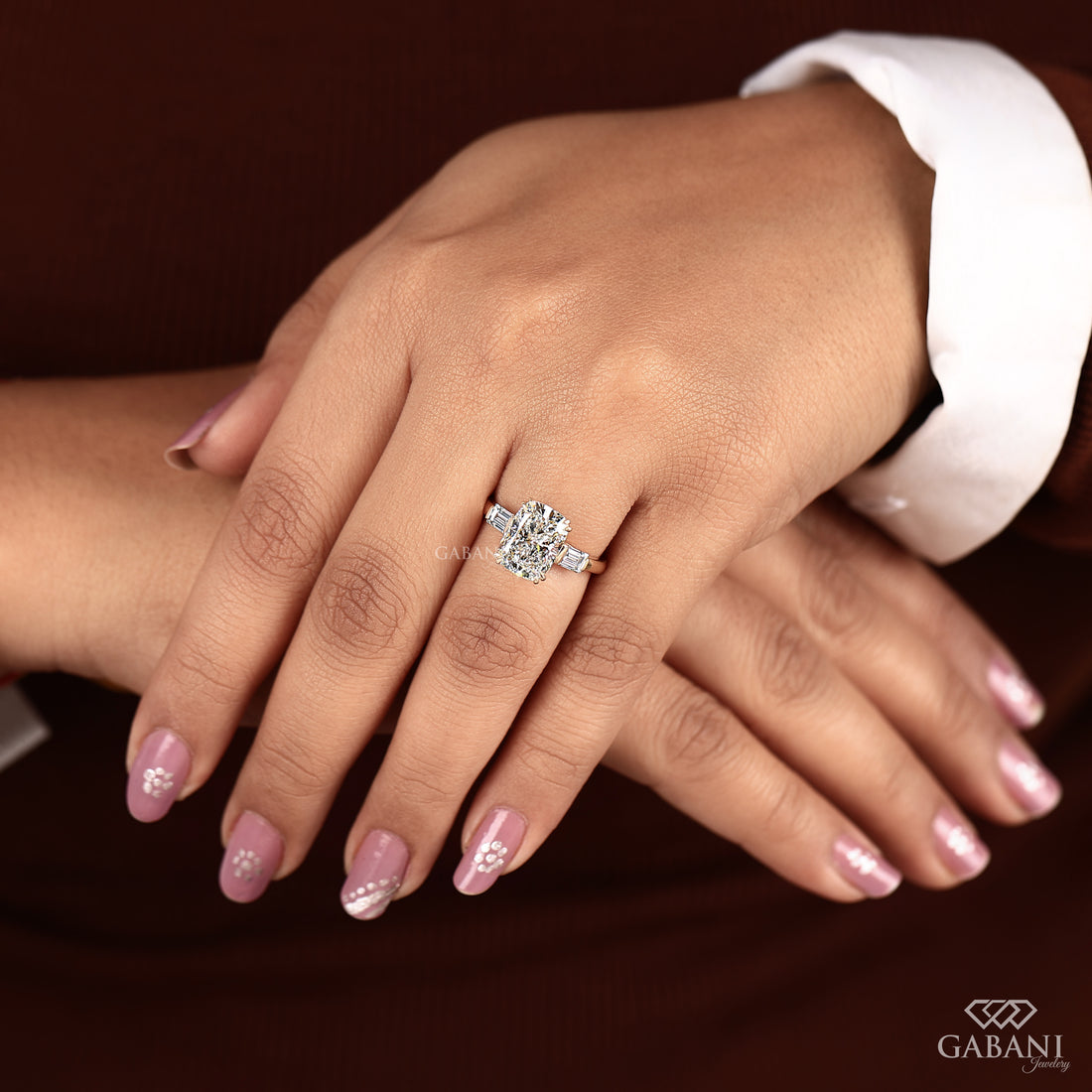 14K yellow gold elongated cushion lab grown diamond ring in model’s hand